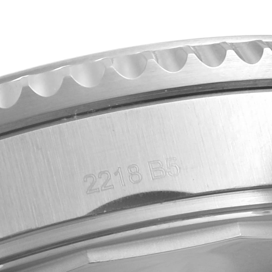 This close-up image shows a portion of the bezel and caseback of a Breitling Navitimer A1331410/C997/189A Men
s Stainless Steel Blue Dial A1331410/C997/189A Men
s Stainless Steel Blue Dial watch.