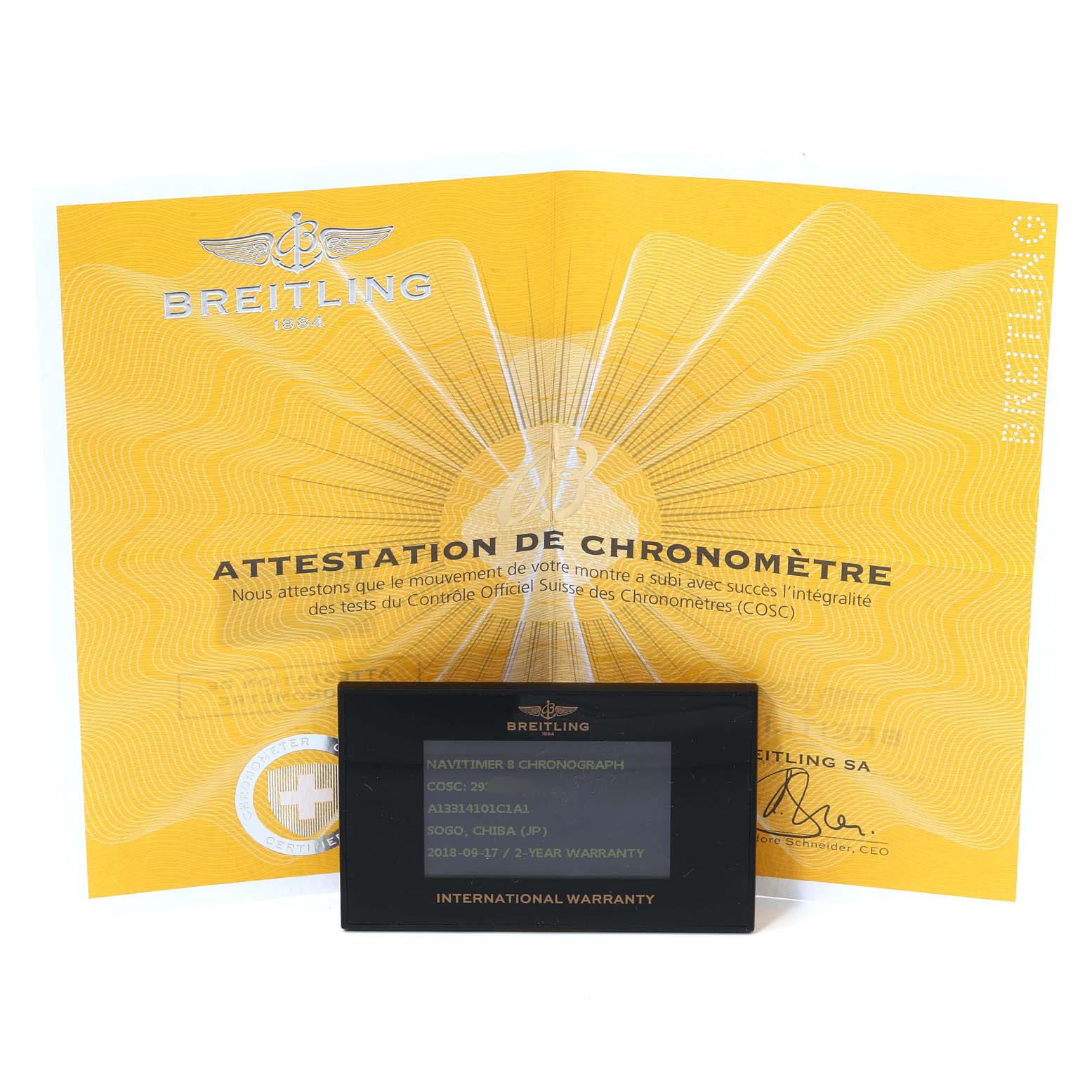 The image shows a Breitling Navitimer A1331410/C997/189A Men
s Stainless Steel Blue Dial A1331410/C997/189A Men
s Stainless Steel Blue Dial model warranty card and chronometer certificate placed side by side.