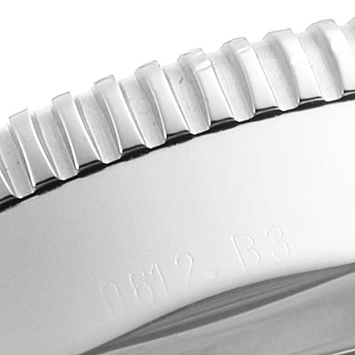 The image shows a close-up of the bezel and part of the case of a Breitling Superocean A17320 Men
s Stainless Steel Silver Dial A17320 Men
s Stainless Steel Silver Dial watch.