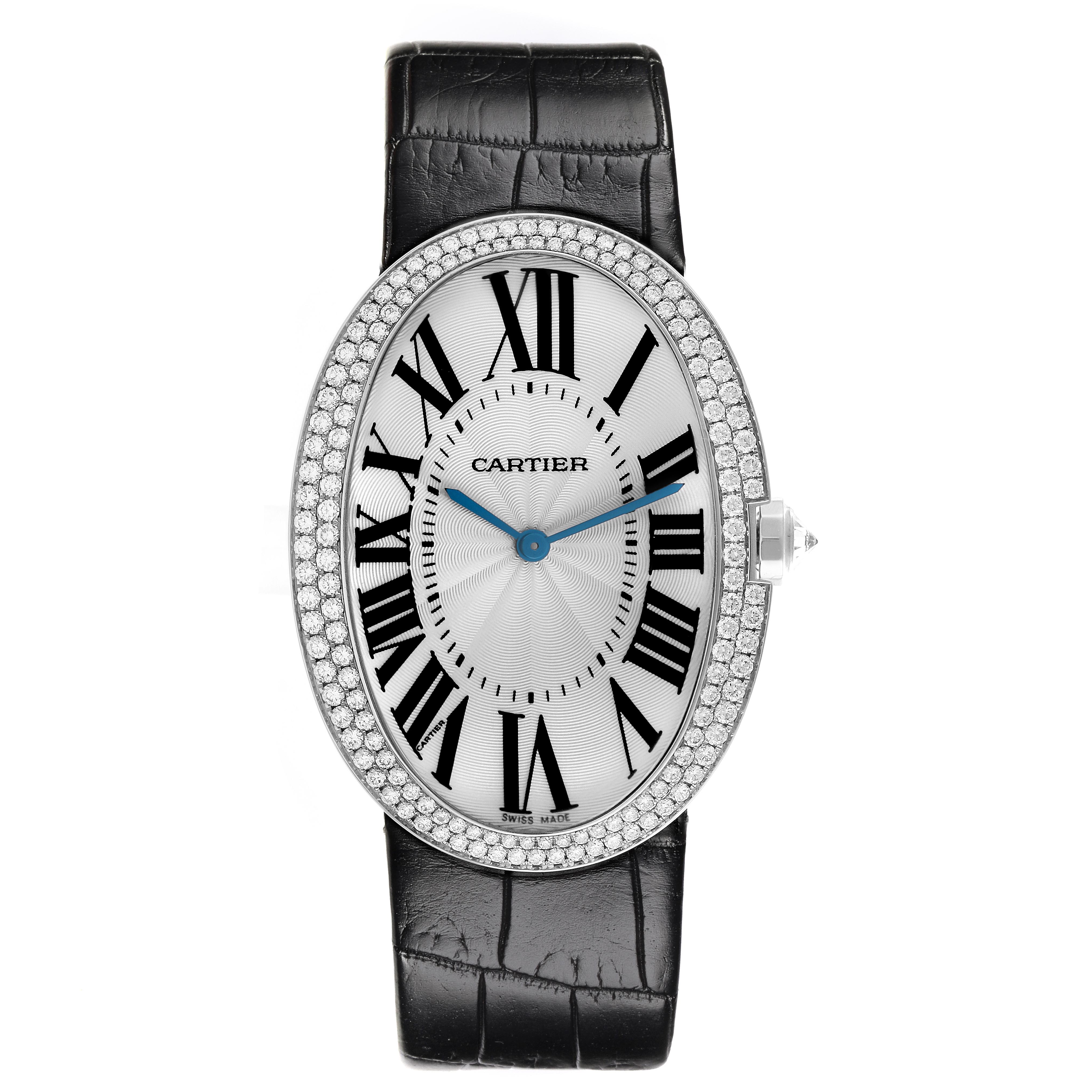 The Cartier Baignoire WB520009 Women
s White Gold Silver Dial WB520009 Women
s White Gold Silver Dial watch is shown from the front, highlighting its oval face, Roman numerals, diamond bezel, and black strap.