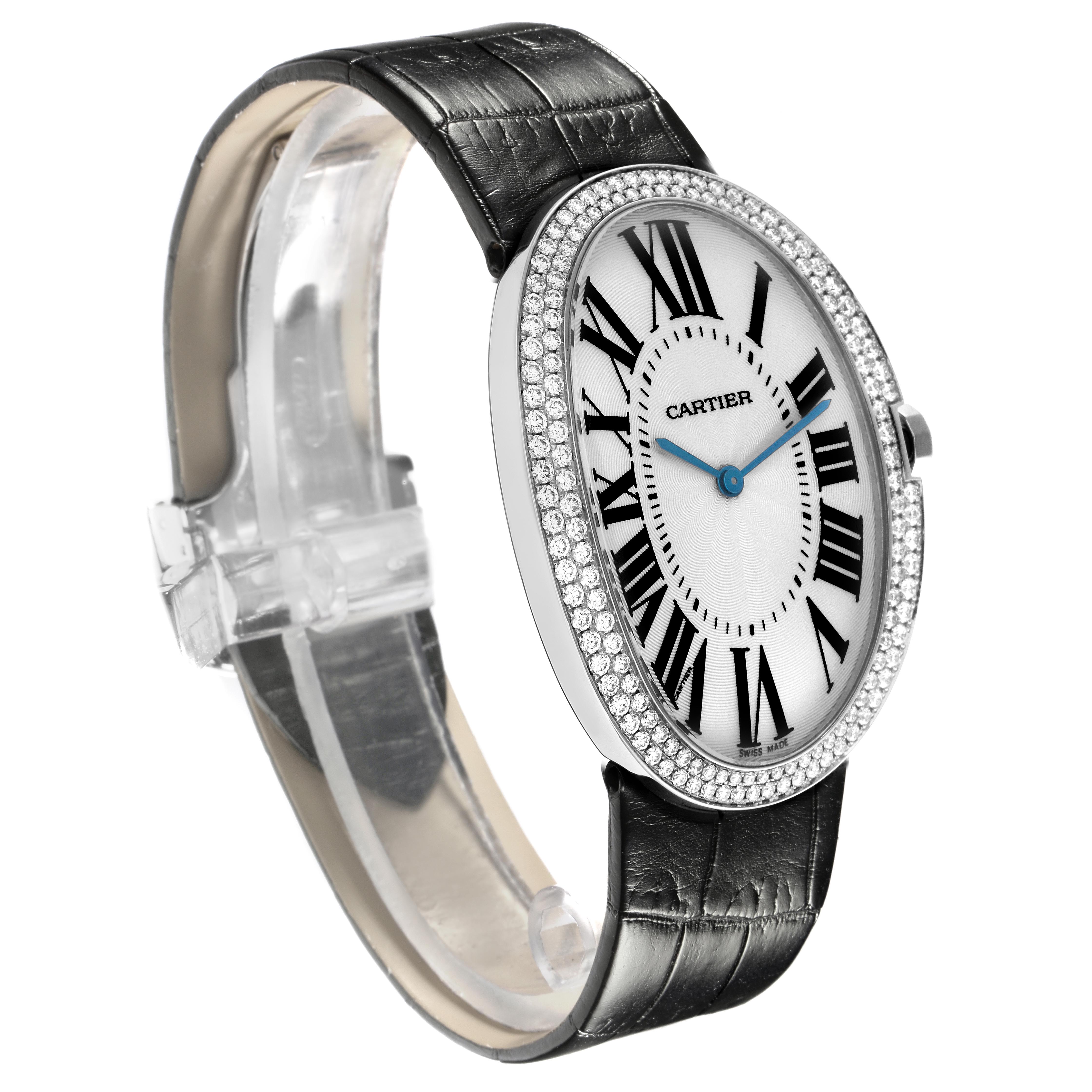 The Cartier Baignoire WB520009 Women
s White Gold Silver Dial WB520009 Women
s White Gold Silver Dial watch is shown from a three-quarter angle, highlighting the oval face, diamond bezel, and leather strap.
