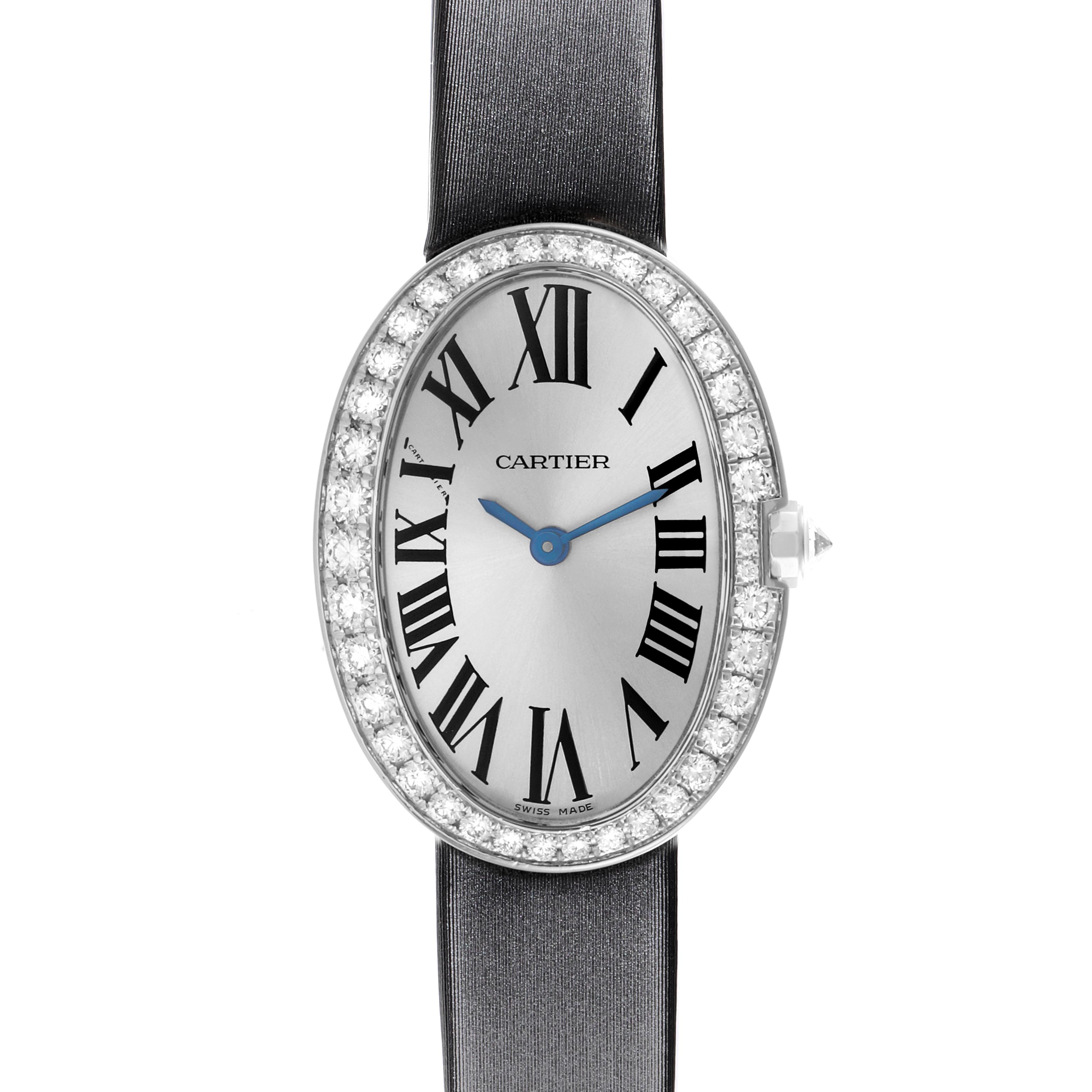 The Cartier Baignoire WB520008 Women
s White Gold Silver Dial WB520008 Women
s White Gold Silver Dial watch is shown from the front, displaying the oval face, Roman numerals, blue hands, and diamond-encrusted bezel.