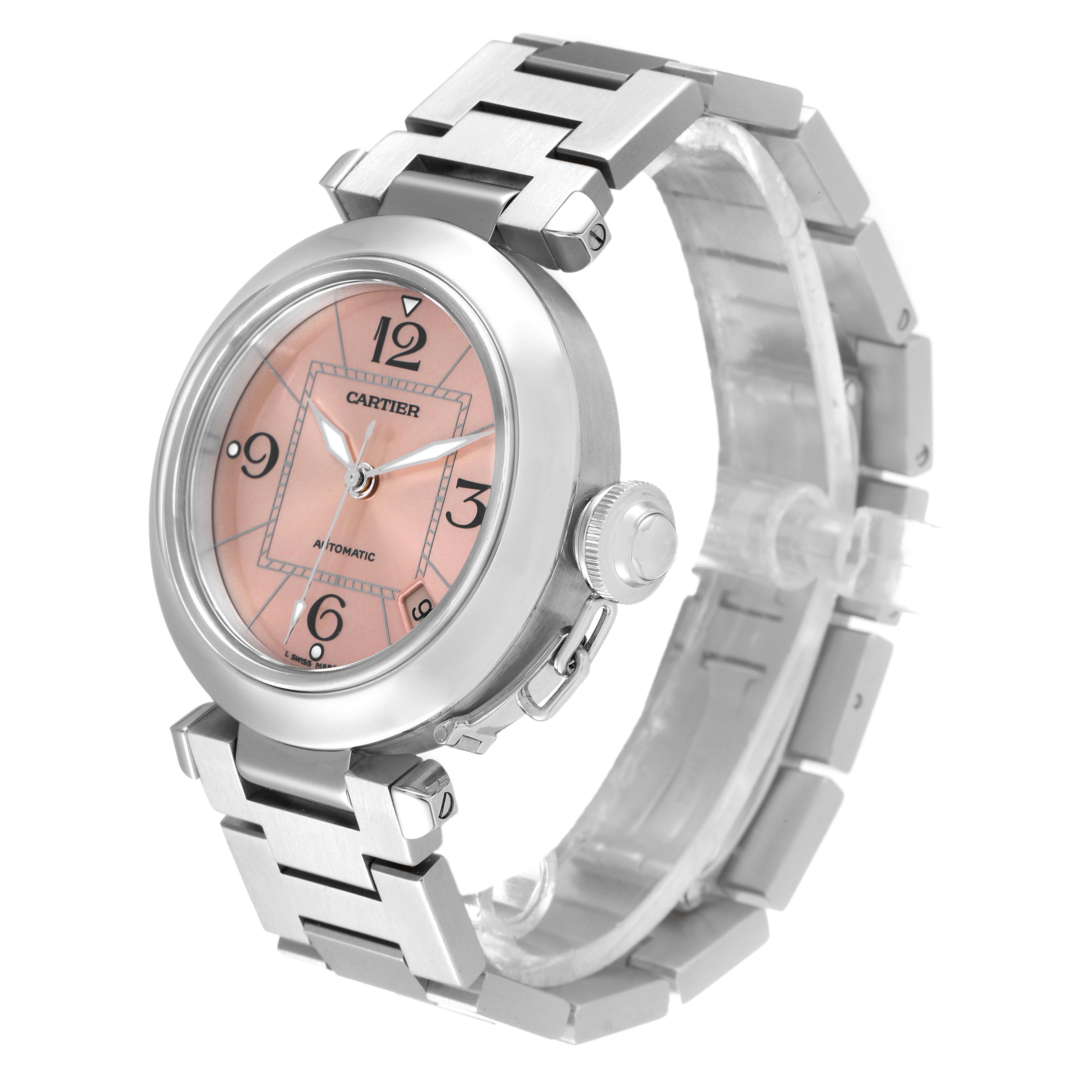 The image shows a Cartier Pasha W31075M7 Women's Stainless Steel Pink Dial W31075M7 Women's Stainless Steel Pink Dial watch at an oblique angle, highlighting its face, case, crown, and bracelet.