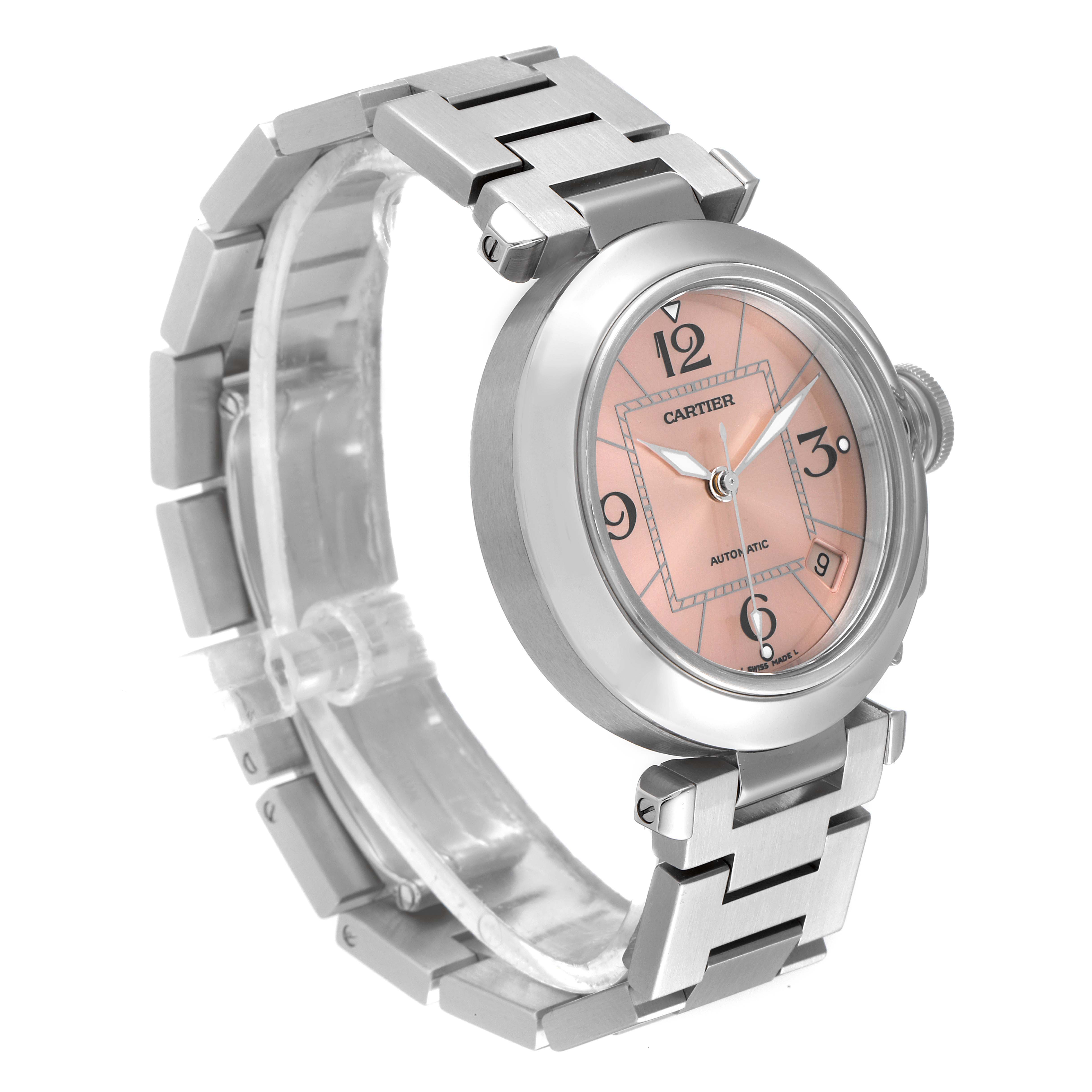 The Cartier Pasha W31075M7 Women's Stainless Steel Pink Dial W31075M7 Women's Stainless Steel Pink Dial watch is displayed at a three-quarter angle, showcasing its bracelet, bezel, and dial with numerals.