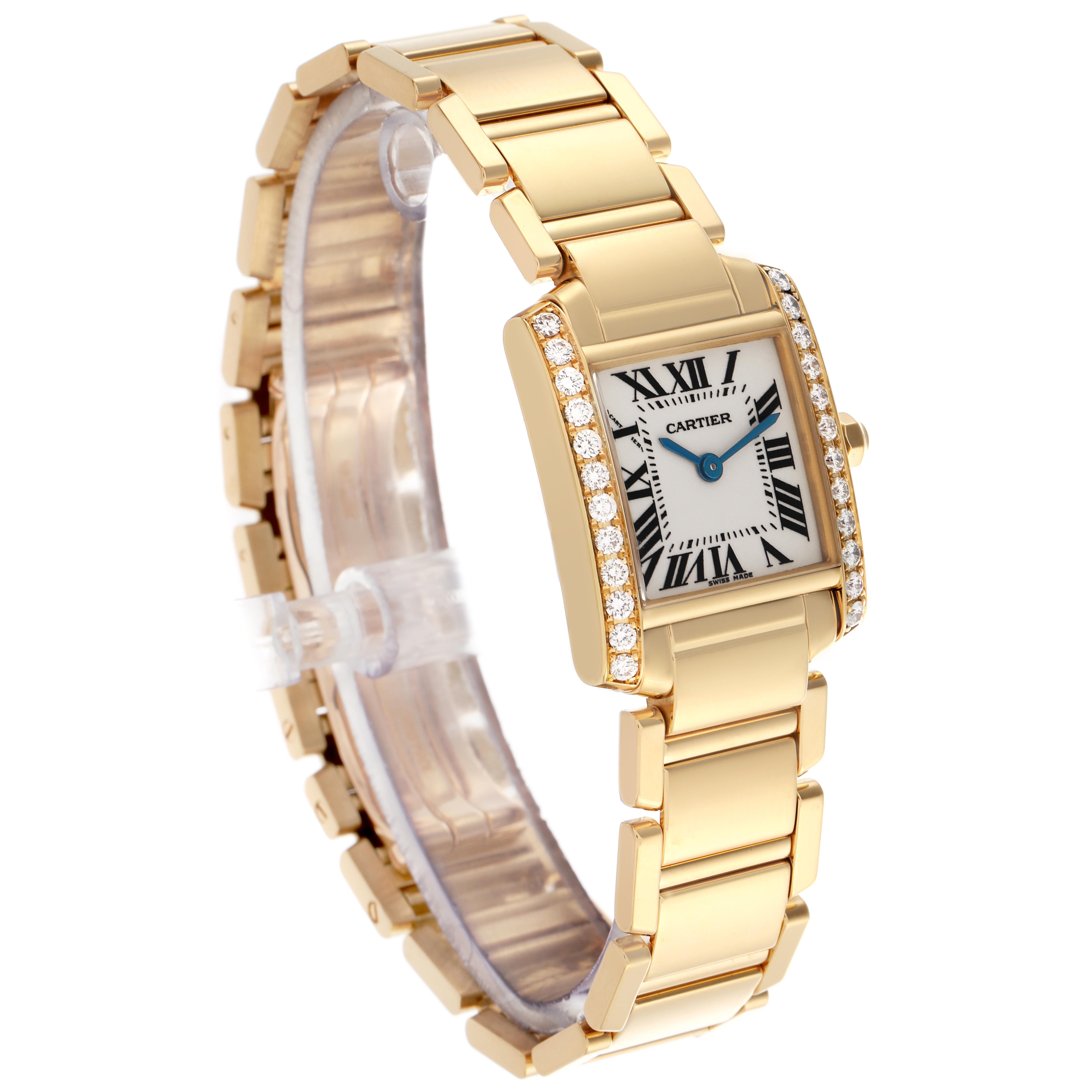 The Cartier Tank Française watch is shown at a slight angle, highlighting its gold bracelet, rectangular face, and diamond detailing.
