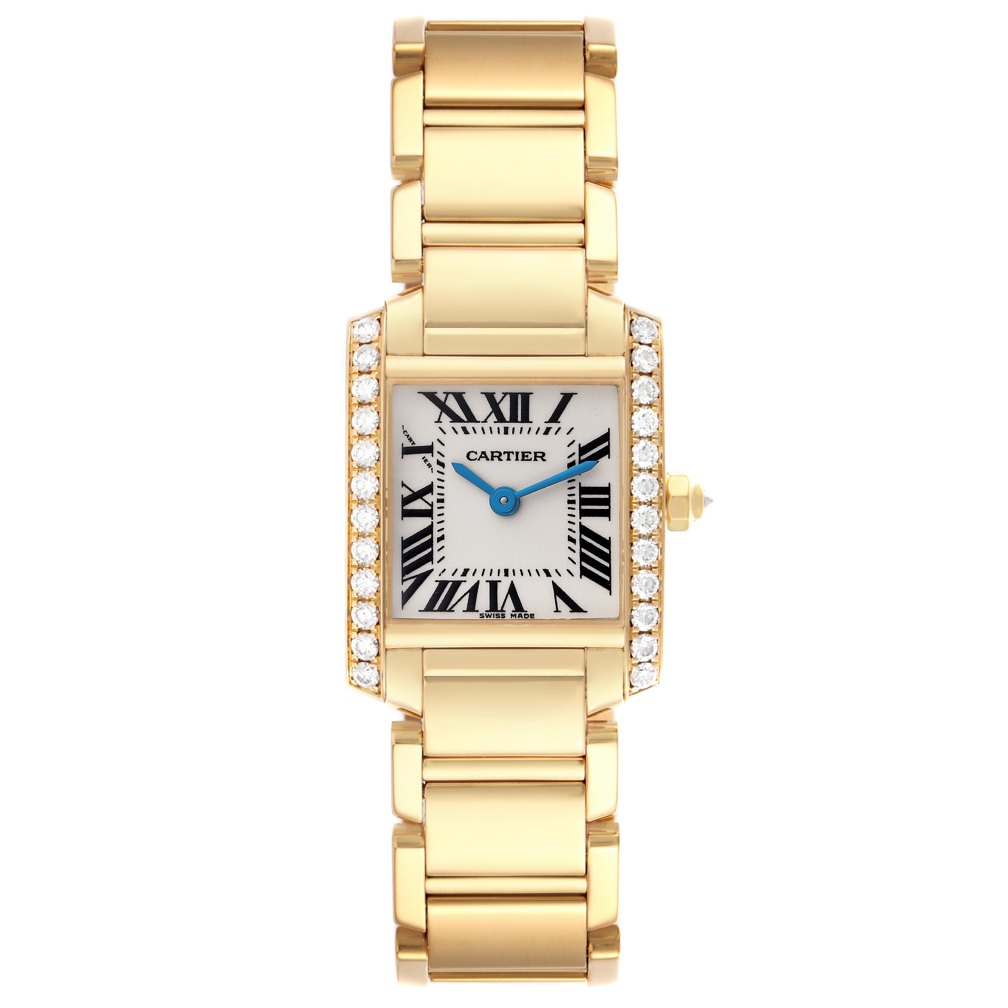 The Cartier Tank Française watch is shown from a top-down angle, featuring a diamond-studded case, gold bracelet, and blue hands.