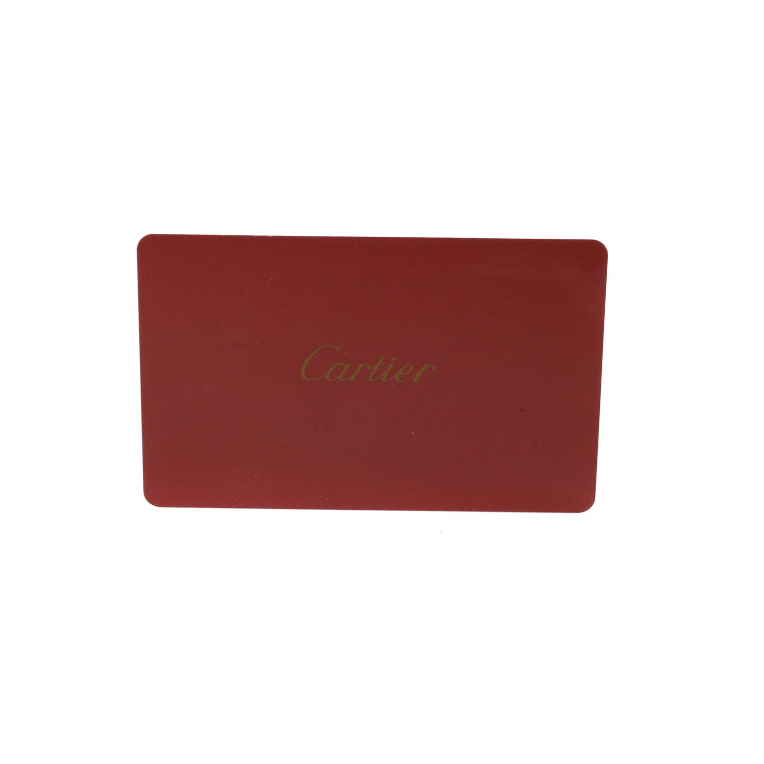The image shows a red Cartier card, likely an accessory or certificate for the Cartier Tank Louis W1529856 Women's Yellow Gold Silver Dial watch.