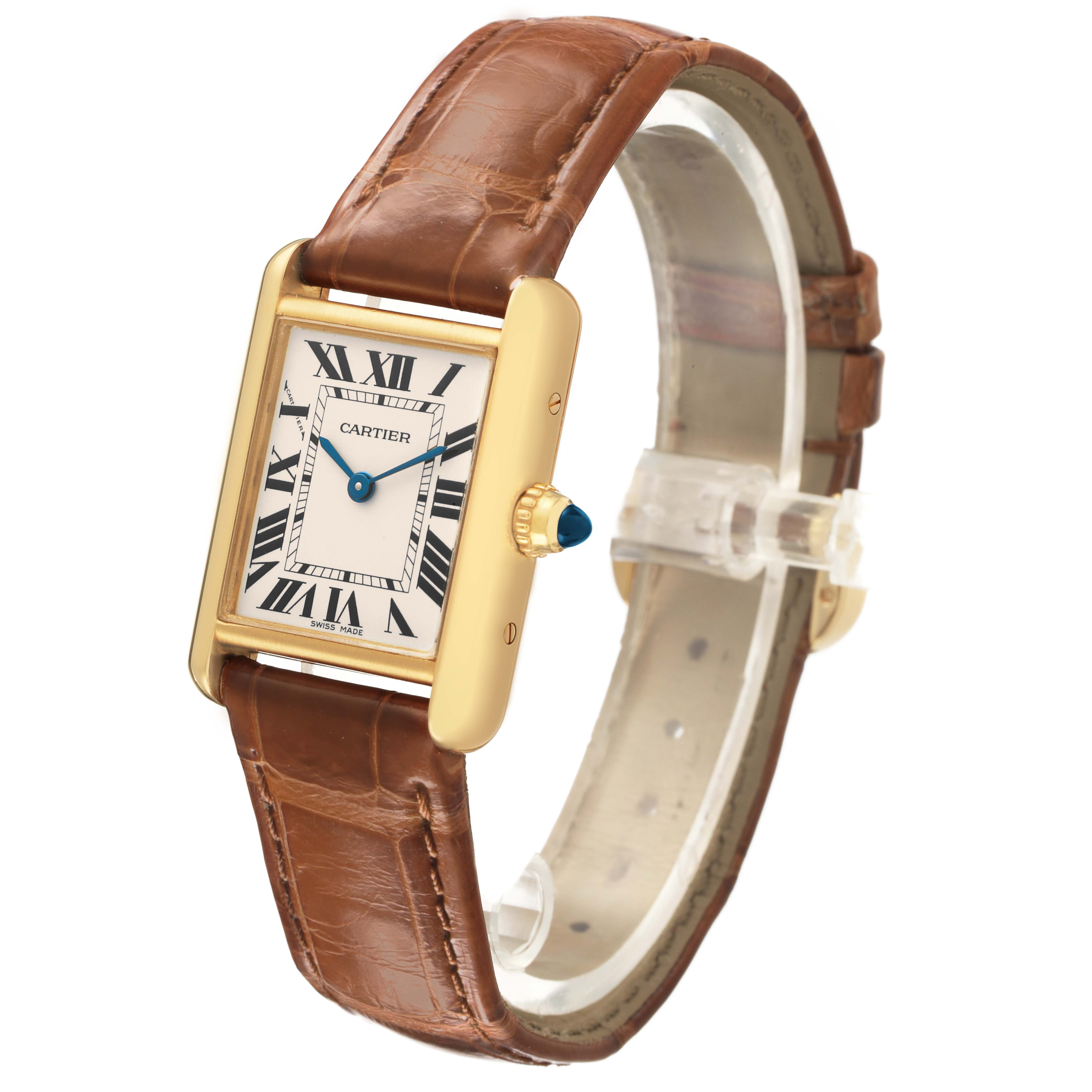 The Cartier Tank Louis W1529856 Women's Yellow Gold Silver Dial watch is shown at a slight angle, highlighting its rectangular face, gold case, blue hands, and brown leather strap.