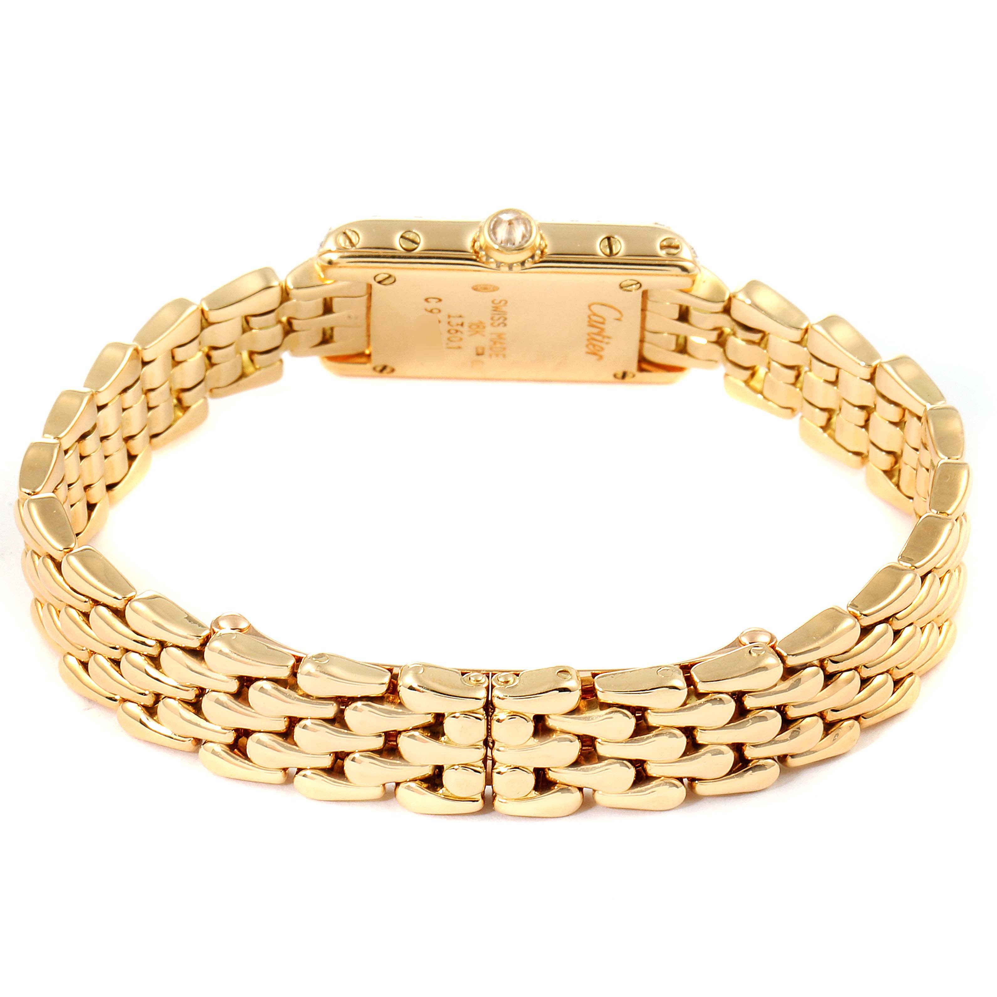 The image shows a rear view of the Tank Louis model watch by Cartier, highlighting the gold bracelet and back casing.