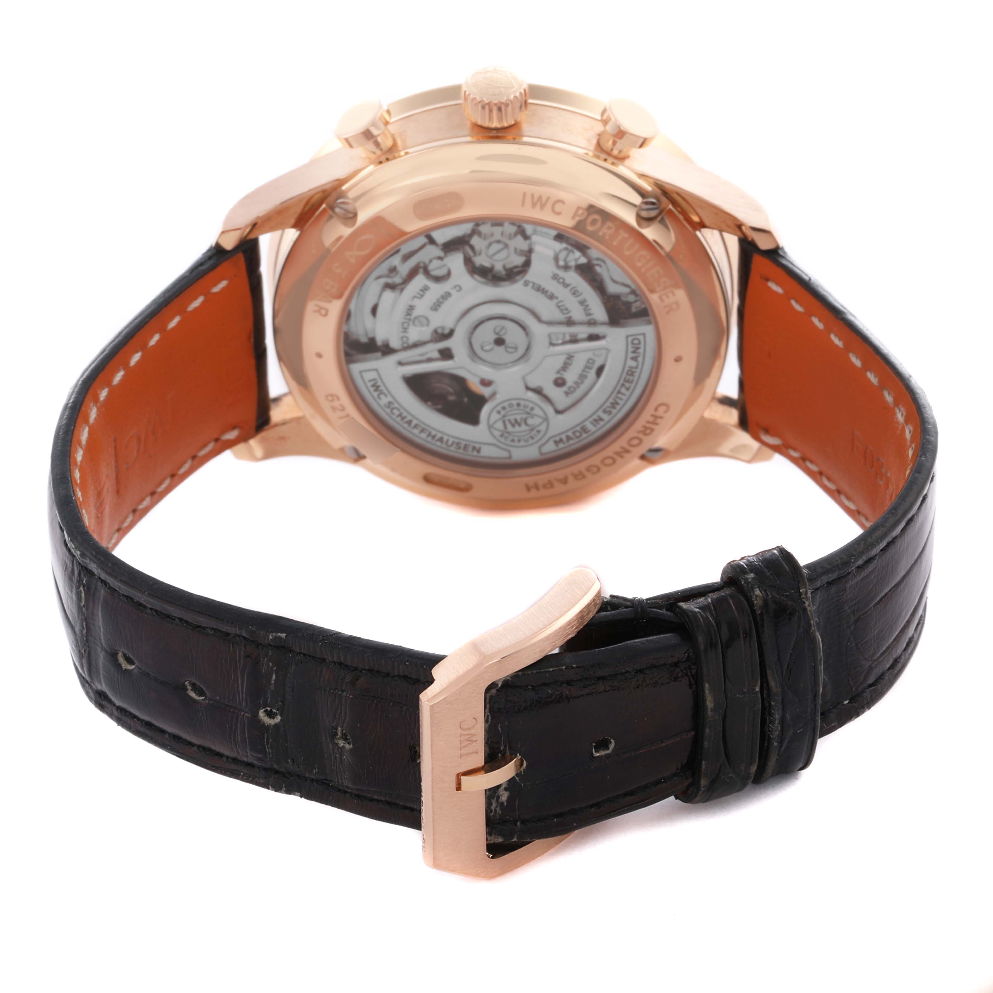 The IWC Portuguese IW371610 Men's Rose Gold Grey Dial IW371610 Men's Rose Gold Grey Dial watch is shown from the back, highlighting its movement and leather strap.