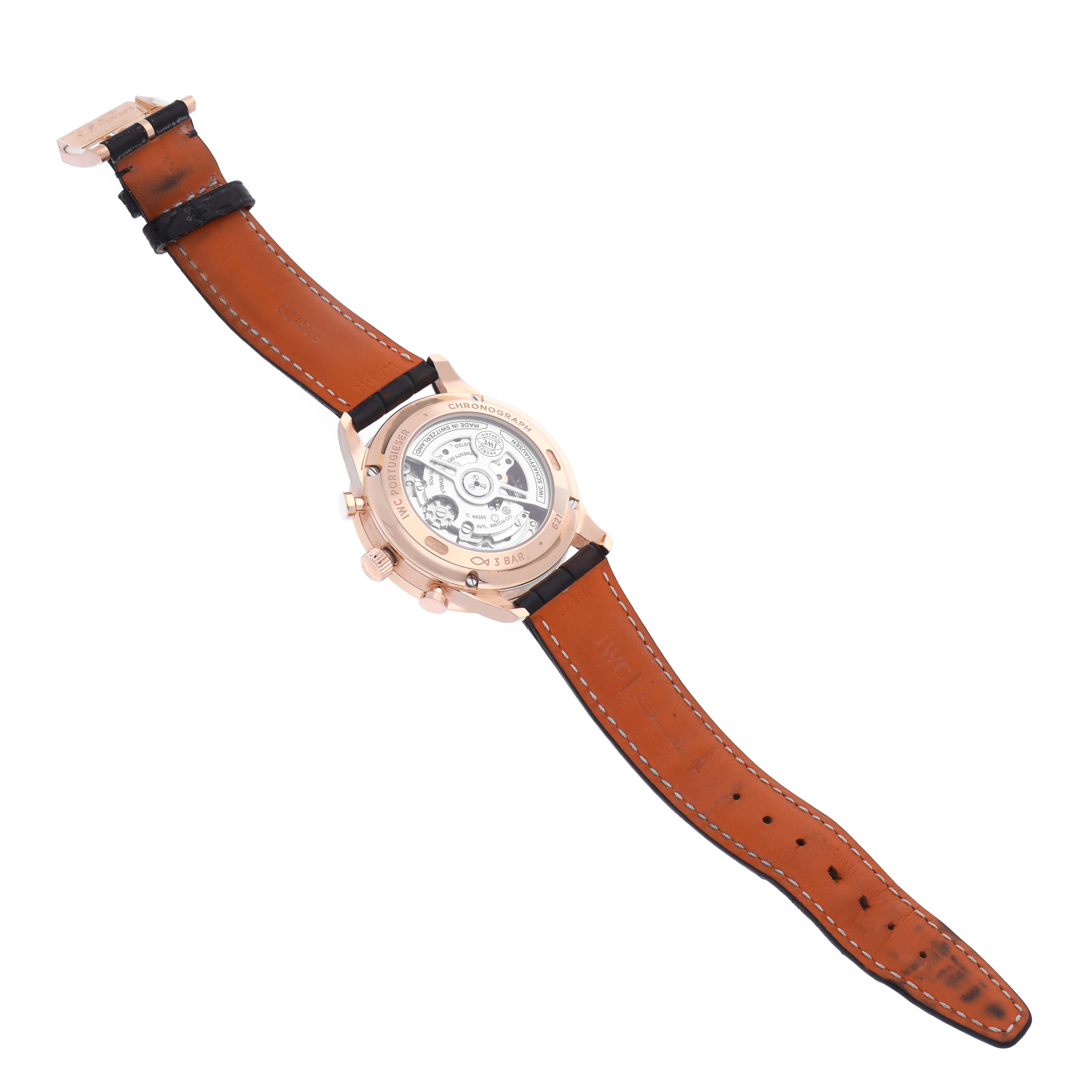 The image shows the back view of an IWC Portuguese IW371610 Men's Rose Gold Grey Dial IW371610 Men's Rose Gold Grey Dial watch, highlighting the transparent case back and leather strap.