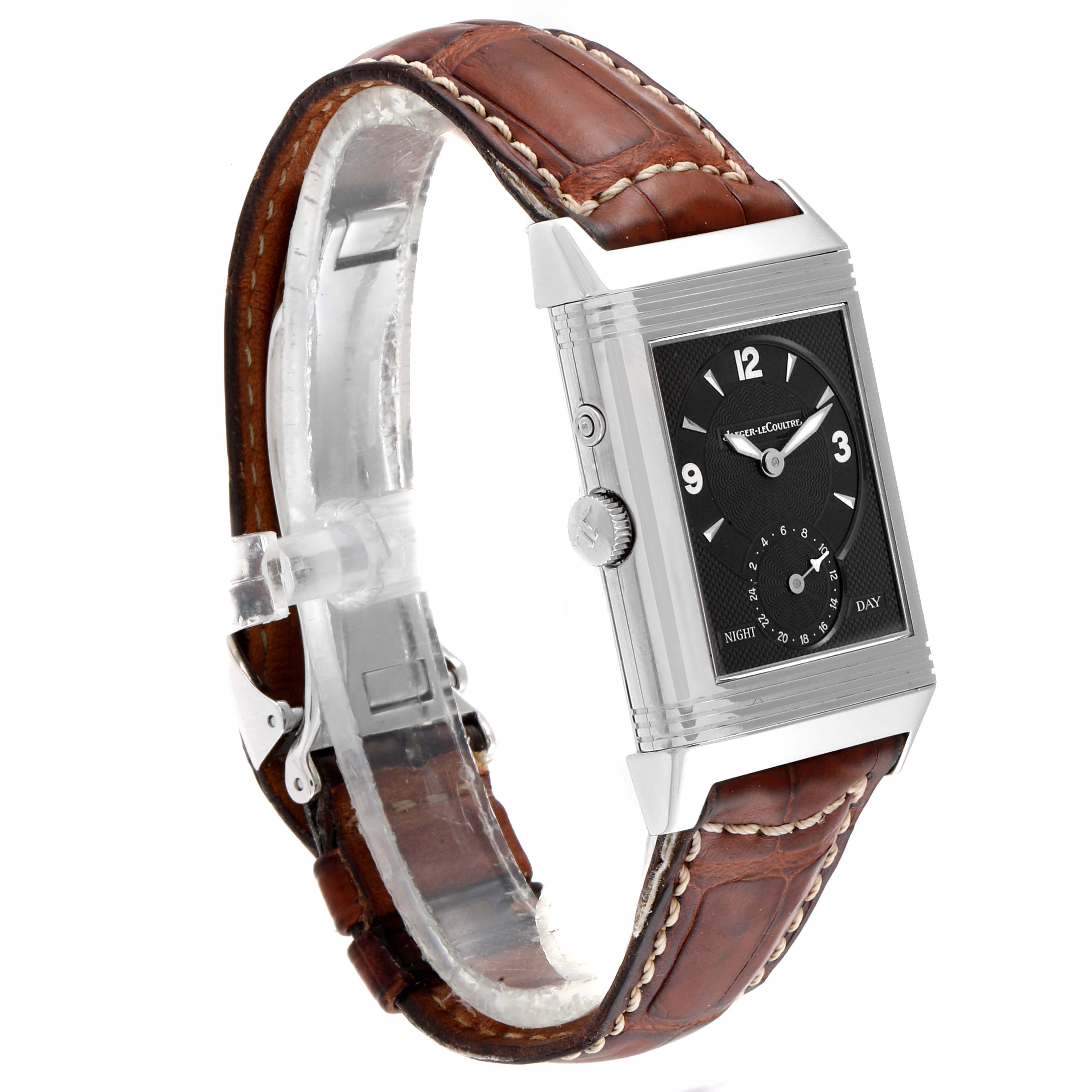 The image shows a Jaeger LeCoultre Reverso Q270854 Men
s Stainless Steel Silver Dial Q270854 Men
s Stainless Steel Silver Dial watch in a side angle, highlighting its rectangular case and brown leather strap.