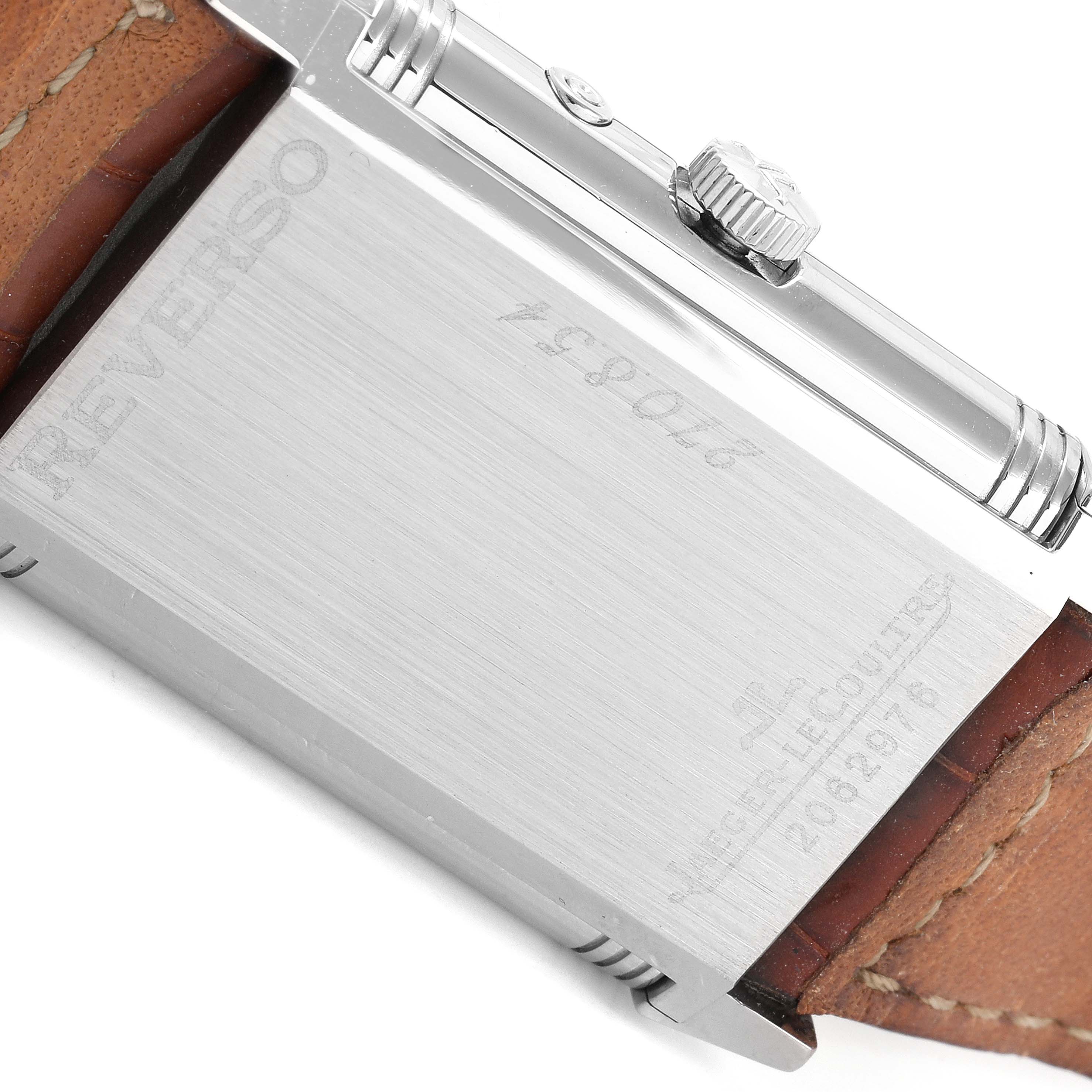 The image shows the back of the Jaeger LeCoultre Reverso Q270854 Men
s Stainless Steel Silver Dial Q270854 Men
s Stainless Steel Silver Dial watch, focusing on the case, crown, and part of the leather strap.