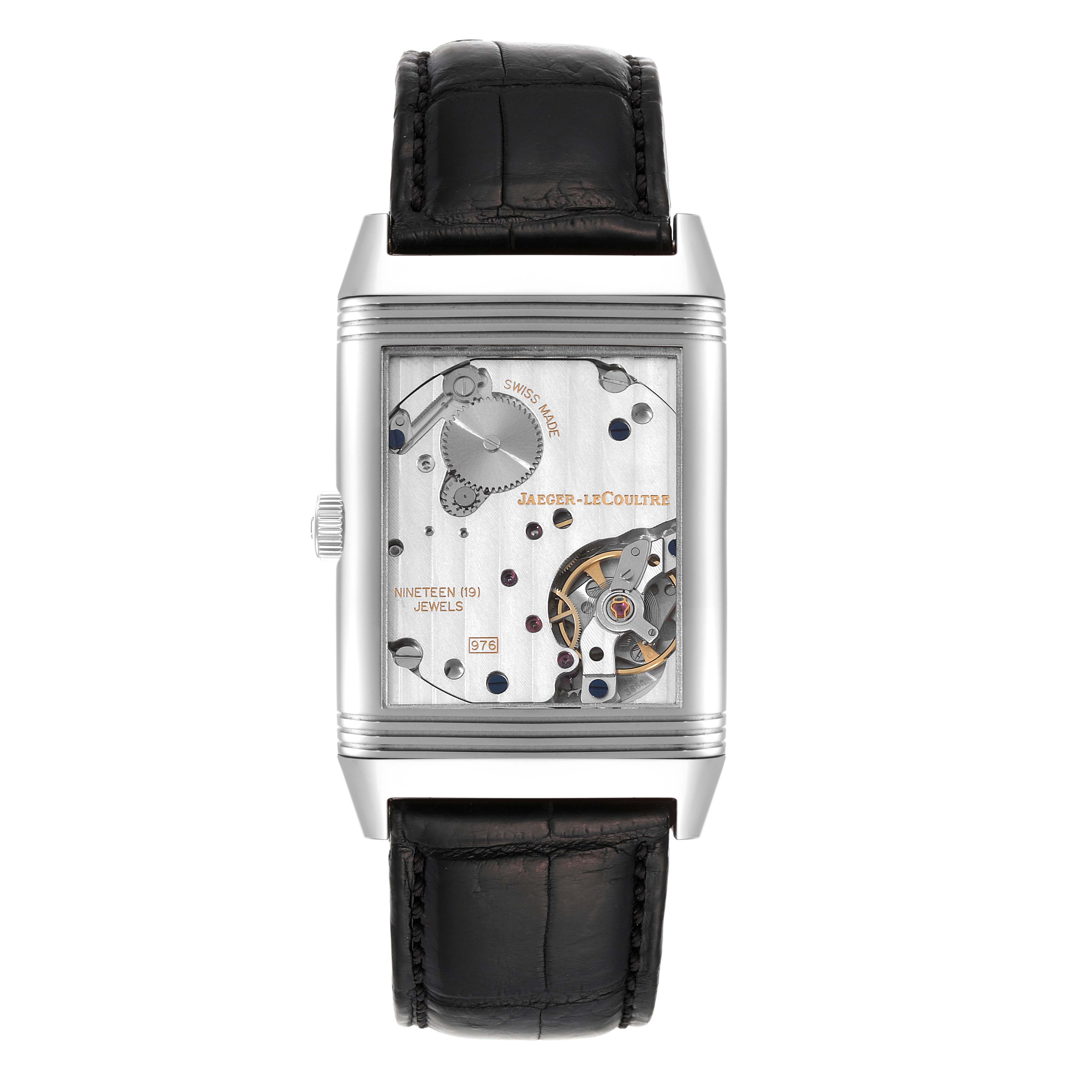 This image shows the back view of a Jaeger-LeCoultre Reverso watch, displaying its internal mechanical movements and components.