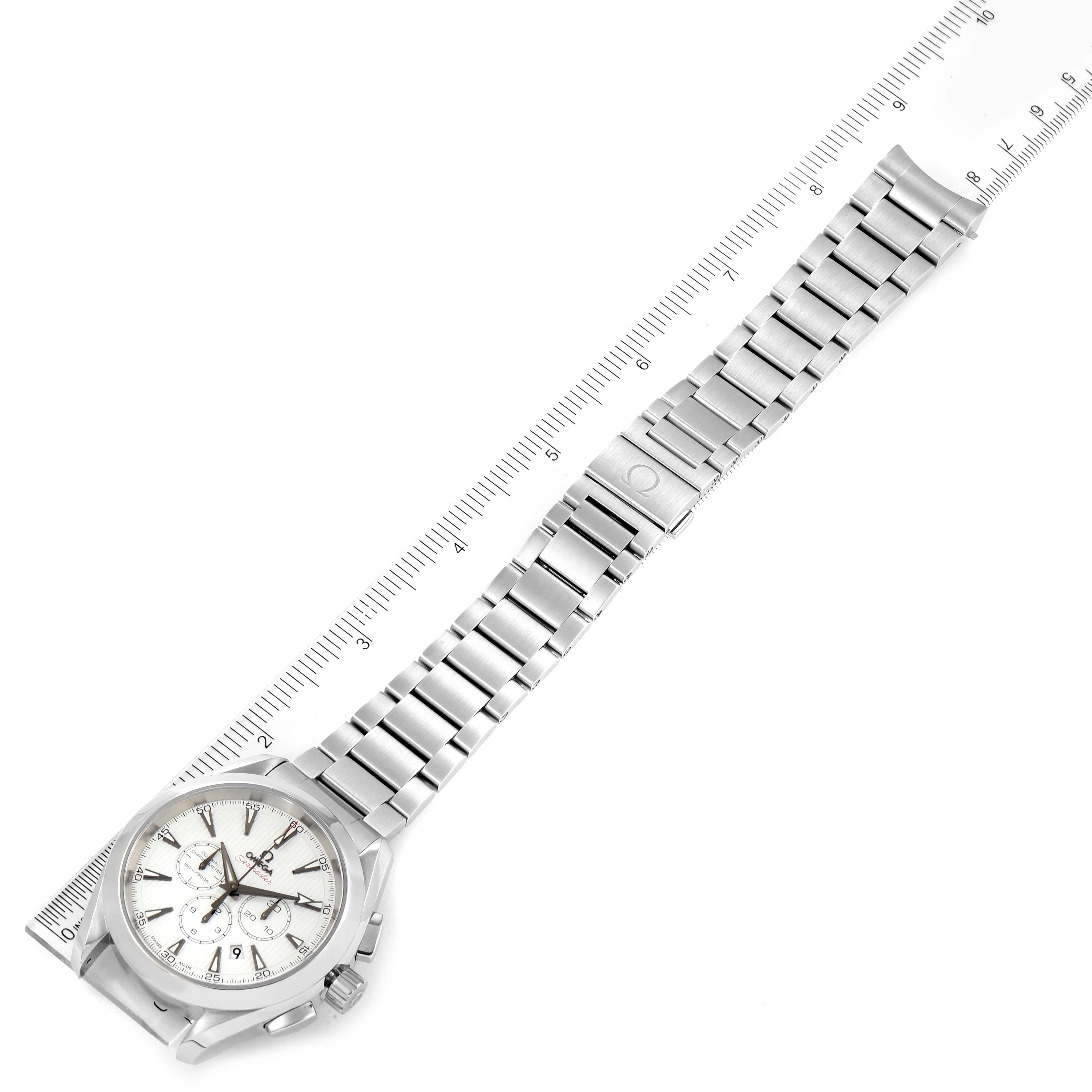 The Aqua Terra by Omega is shown from a top-down angle, highlighting the full watch and metal bracelet alongside a ruler.