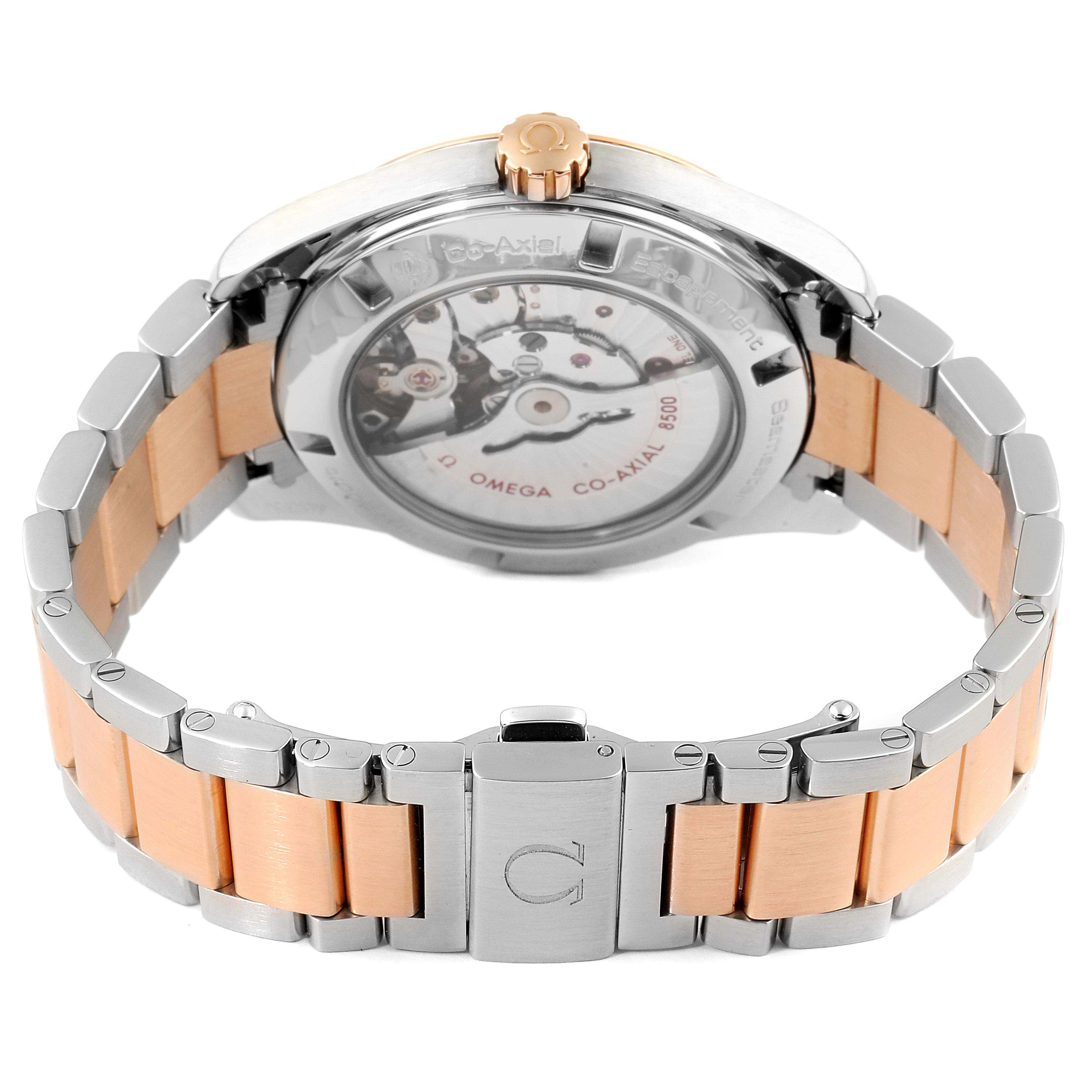 The image shows the Aqua Terra by Omega from the rear, highlighting its transparent case back and two-tone bracelet.
