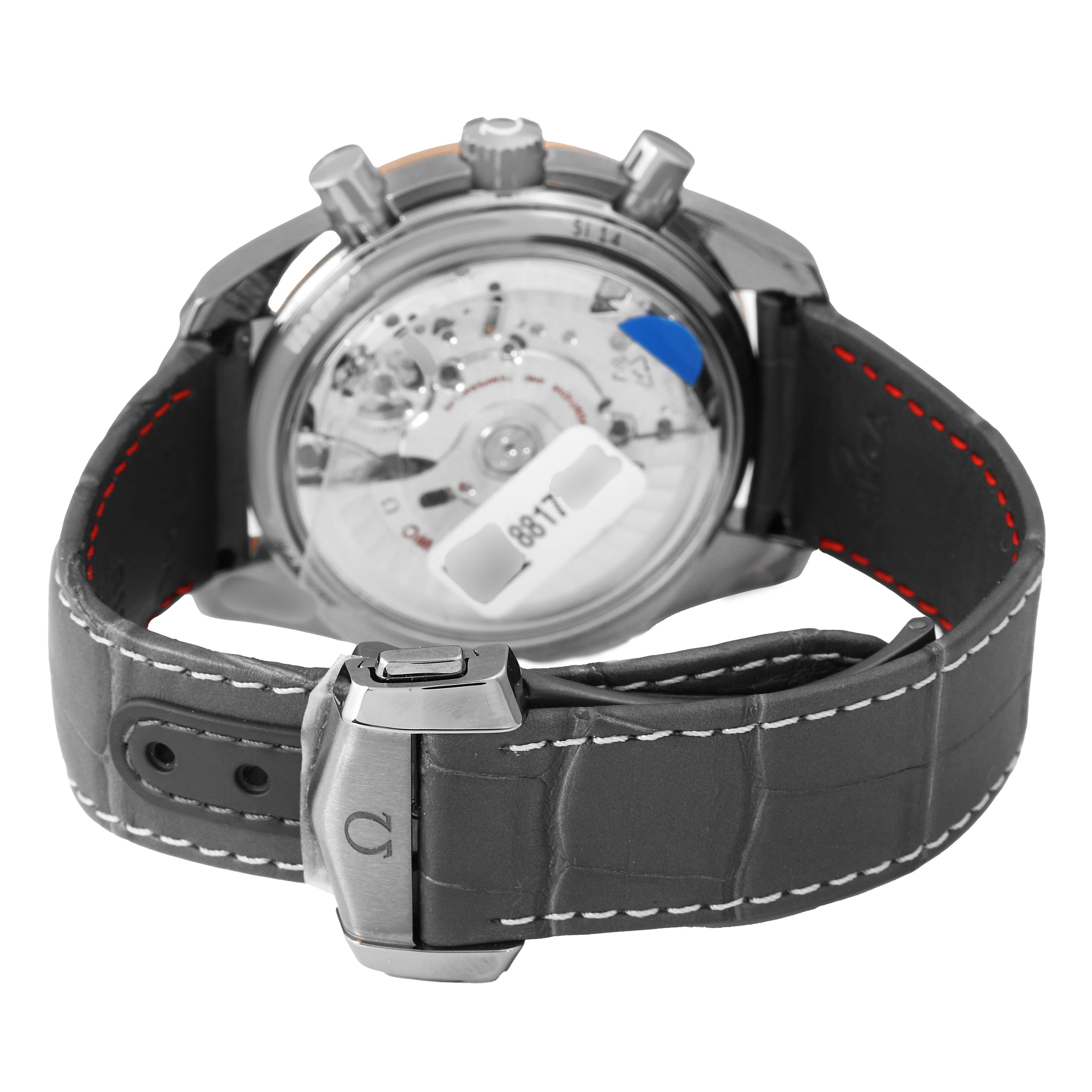 The image shows the Omega Speedmaster 311.63.44.51.99.001 Men's Ceramic Grey Dial's back view highlighting the transparent case back and leather strap with clasp.