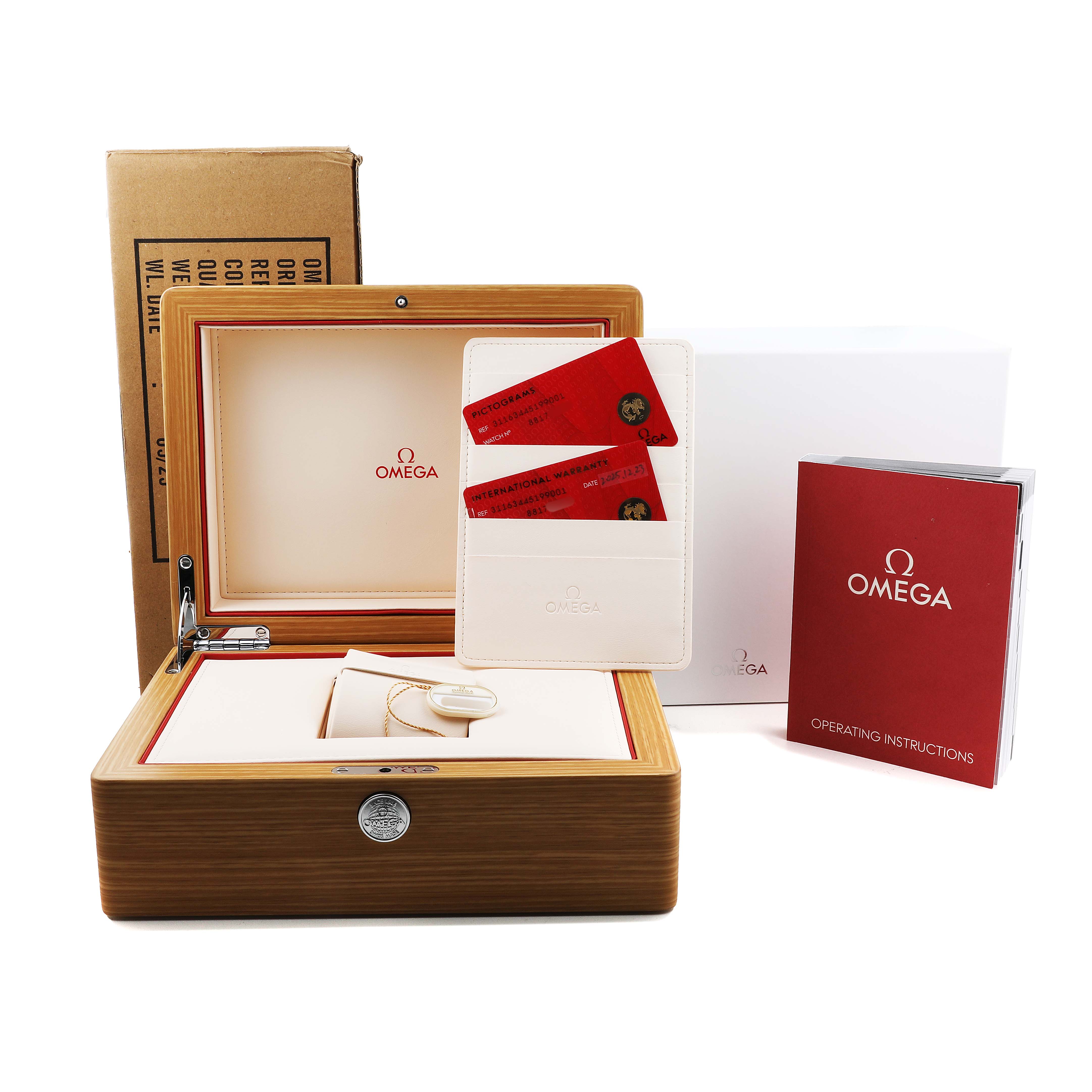 The image shows the Omega Speedmaster 311.63.44.51.99.001 Men's Ceramic Grey Dial's display box, cards, manual, and packaging viewed from the front.