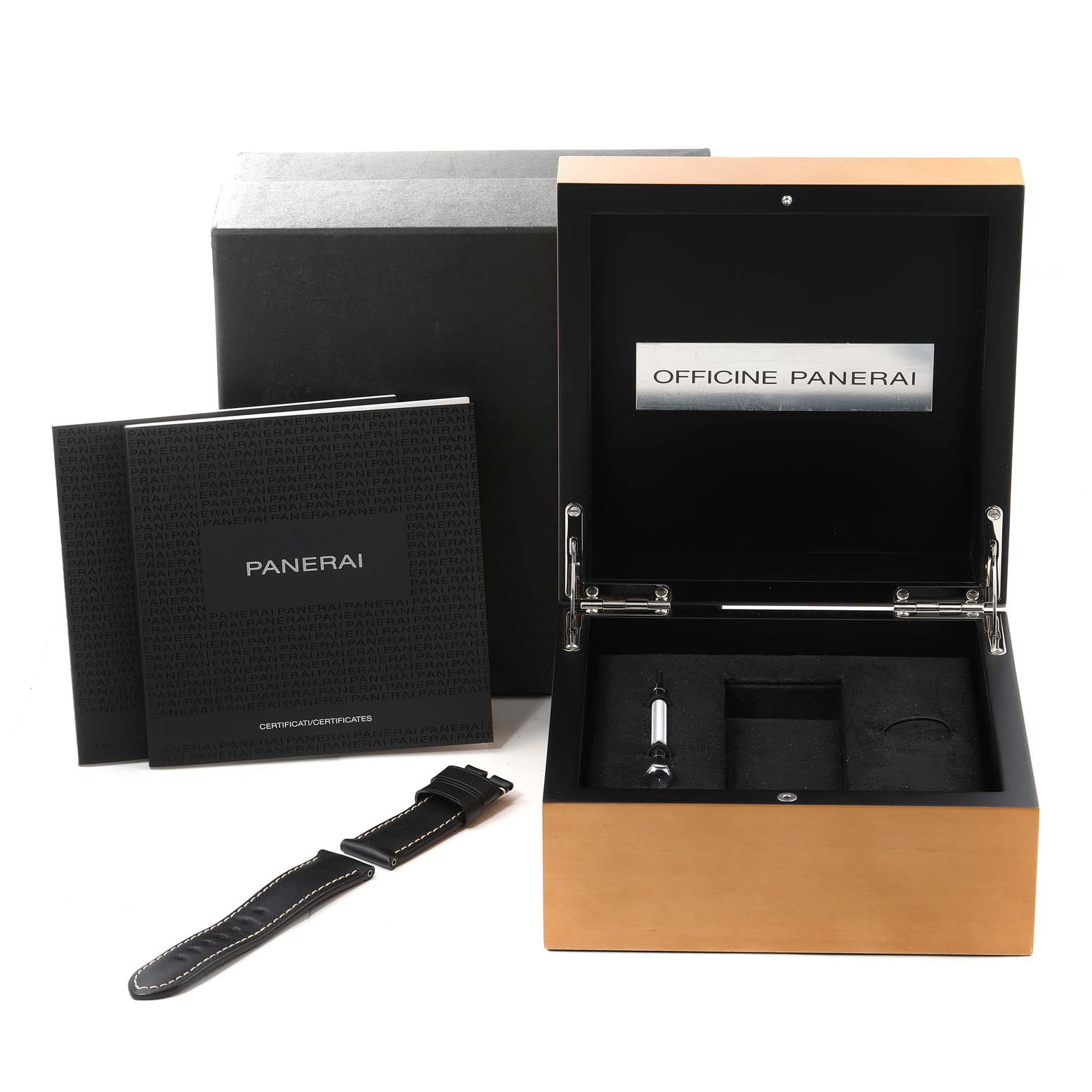 The image shows the open box and accessories of a Panerai Luminor PAM00510 Men
s Stainless Steel Black Dial PAM00510 Men
s Stainless Steel Black Dial watch, including a strap, tool, and documentation.
