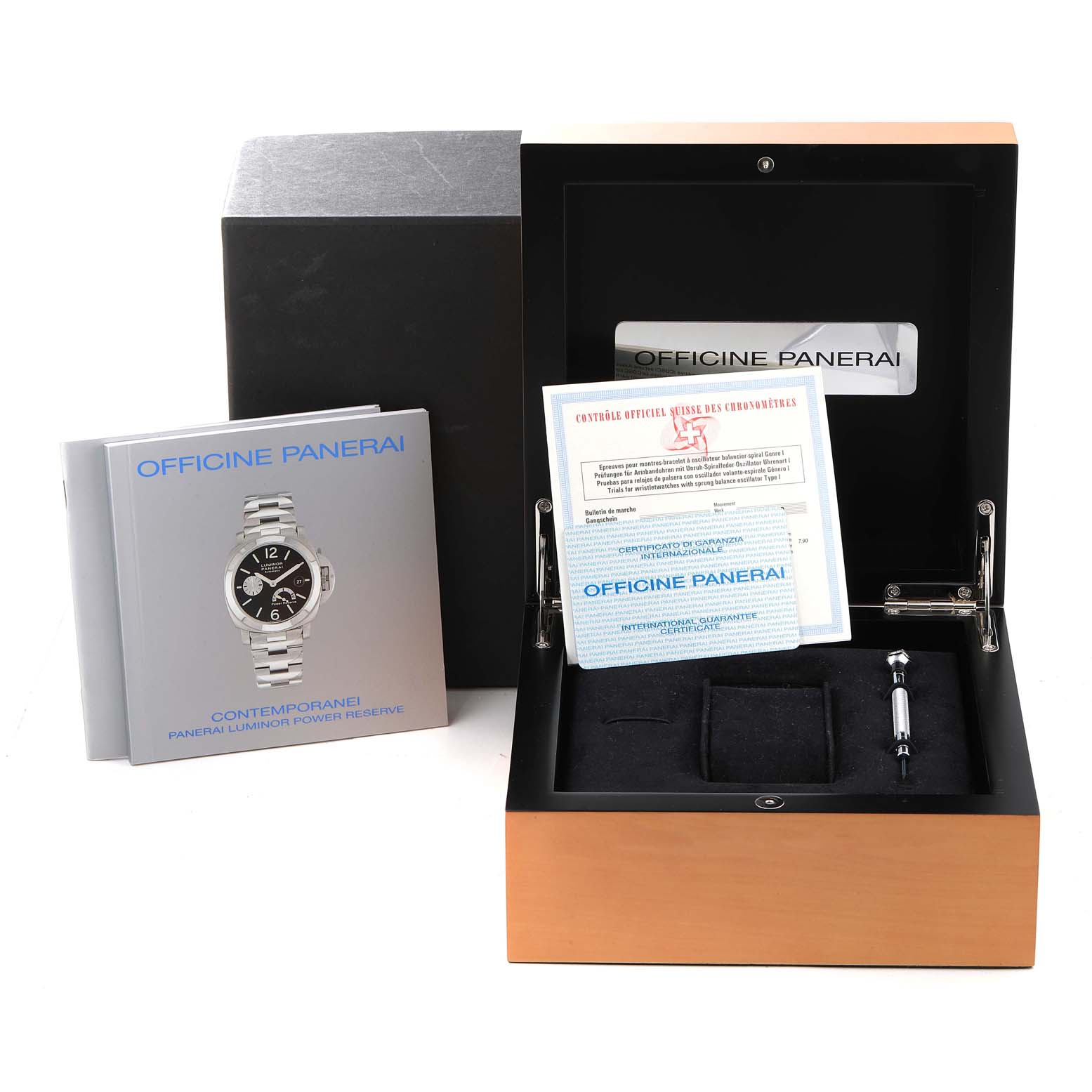 The image shows the open box, manuals, and accessories of a Panerai Luminor PAM00090 Men
s Stainless Steel Black Dial PAM00090 Men
s Stainless Steel Black Dial watch from a front angle.