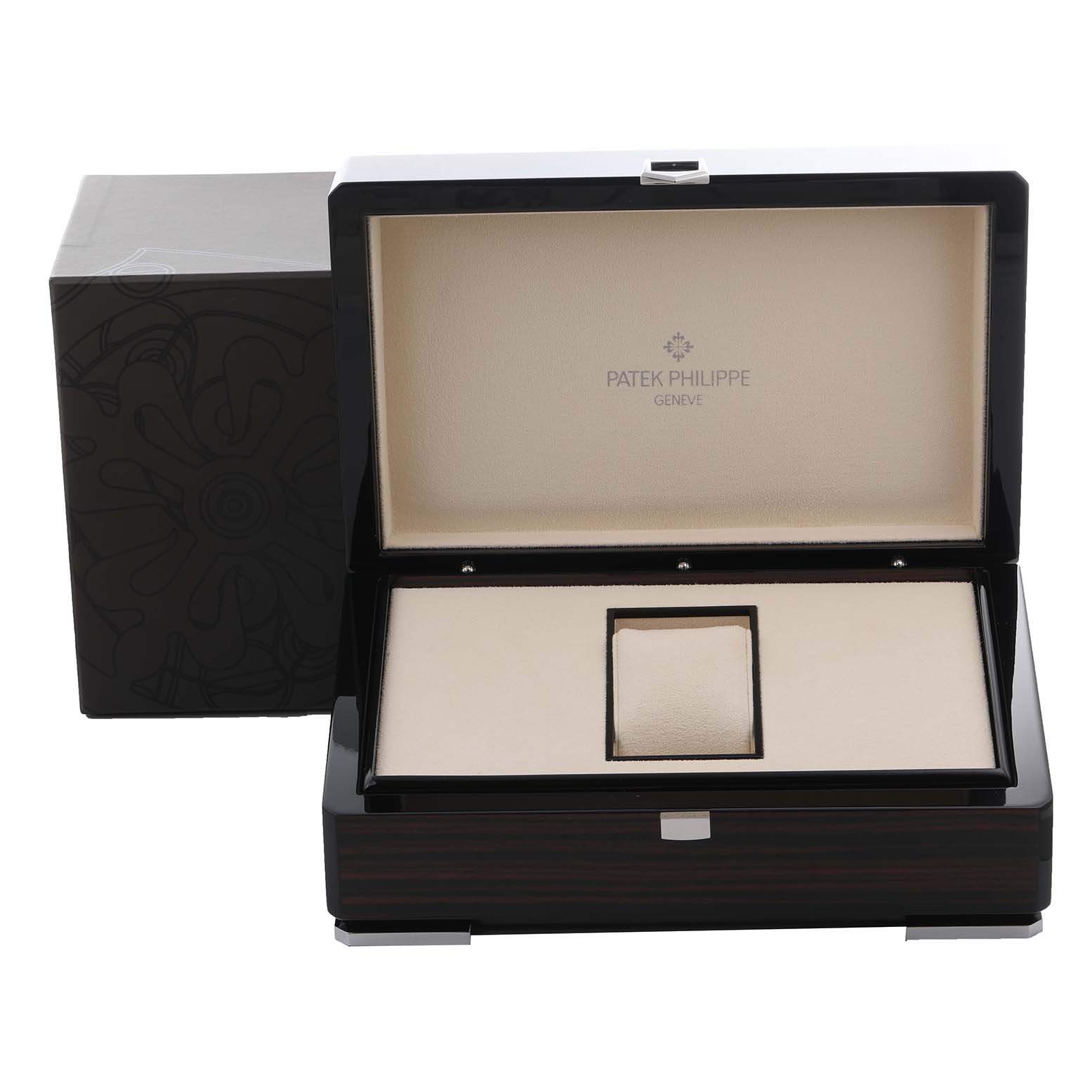 The image shows a Patek Philippe Complications 5139G Men's White Gold Black Dial 5139G Men's White Gold Black Dial watch box open, revealing its cushioned interior and external packaging.