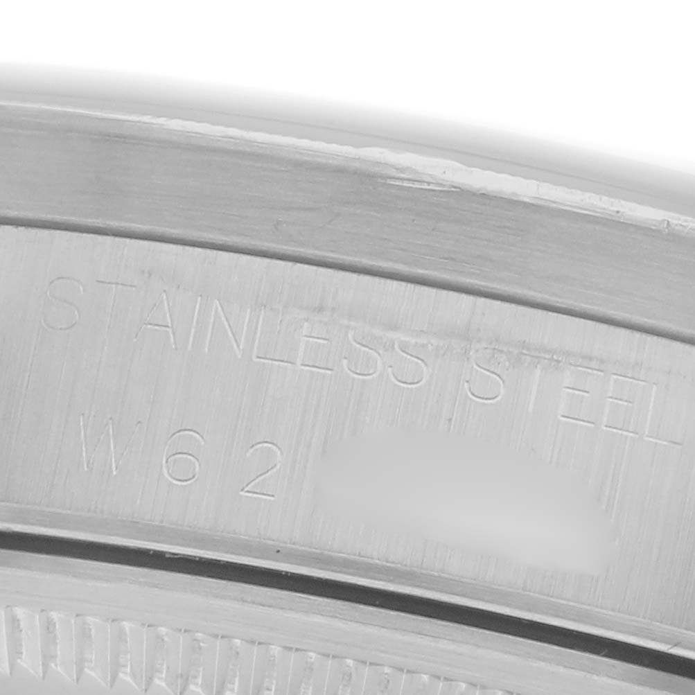 The image shows a close-up of the stainless steel casing with engravings on the Rolex Air-King 14010 Men's Stainless Steel White Dial 14010 Men's Stainless Steel White Dial watch.