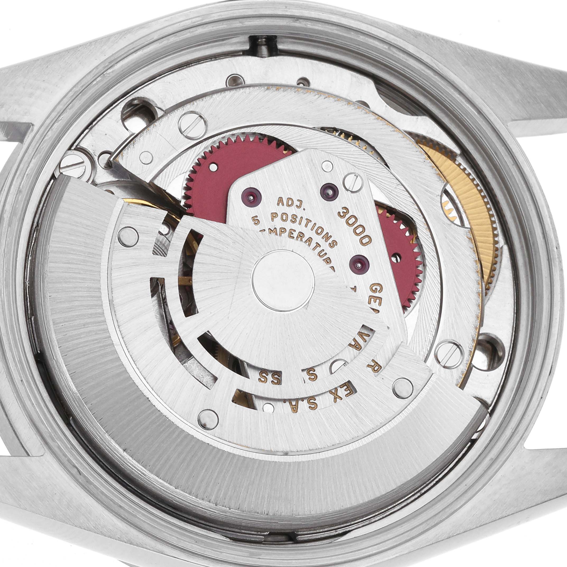 The image shows the movement mechanism of the Rolex Air-King 14010 Men's Stainless Steel Silver Dial 14010 Men's Stainless Steel Silver Dial watch from the back, highlighting gears and engravings.