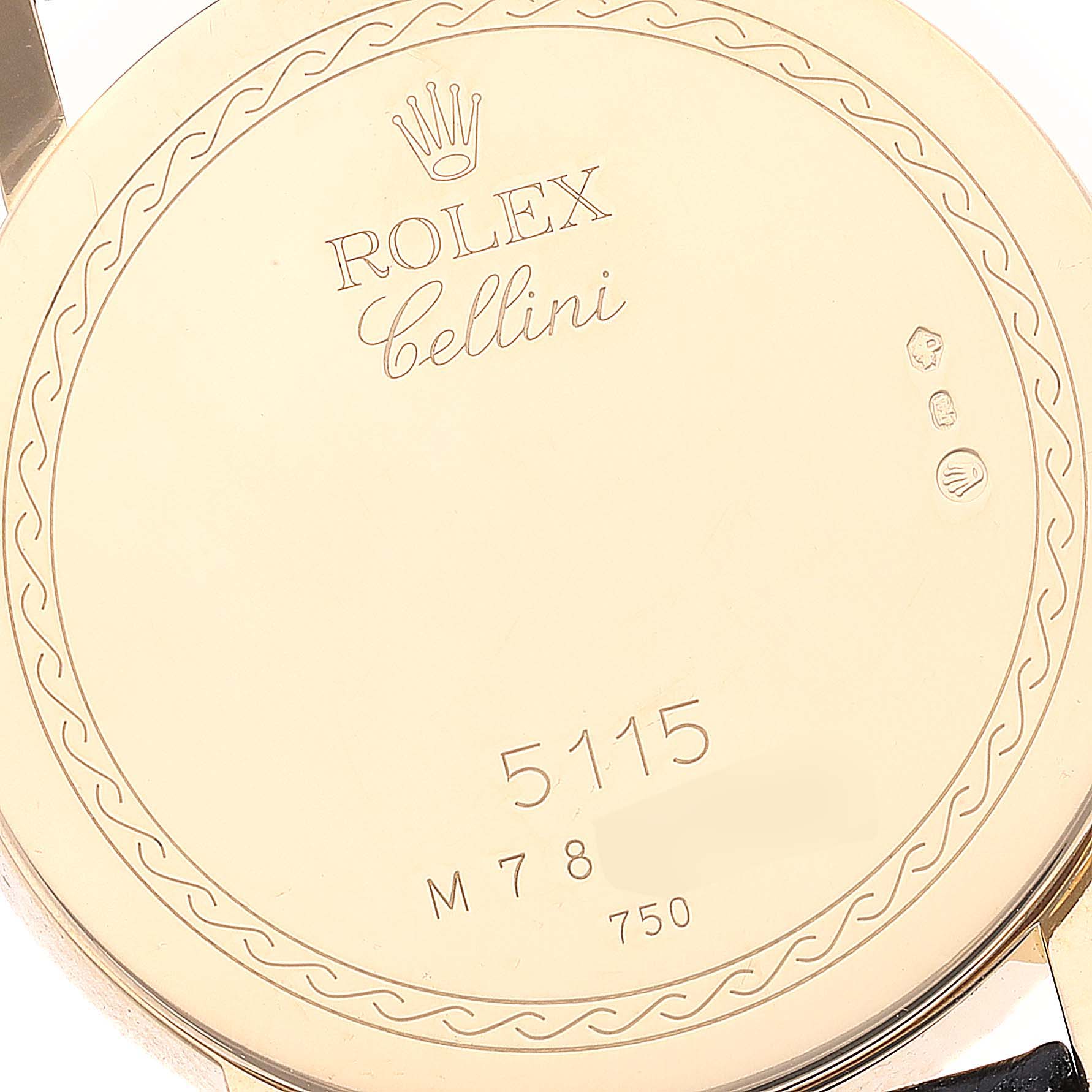 This image shows the back case of a Rolex Cellini 5115/8 Men's Yellow Gold Beige Dial 5115/8 Men's Yellow Gold Beige Dial watch, displaying the brand name, model number "5115," and hallmark stamps.