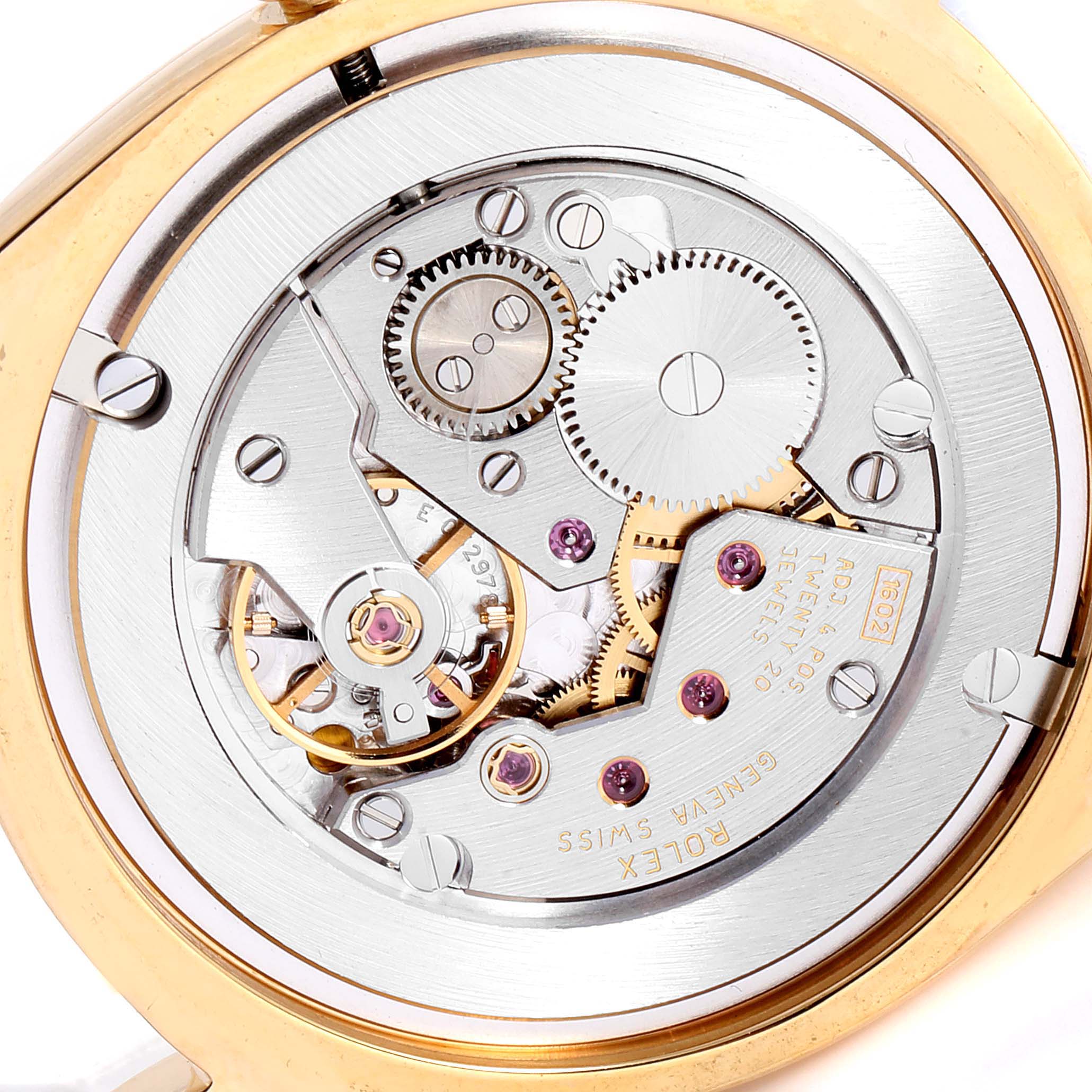 This image shows the intricate inner mechanical movement of a Rolex Cellini 4233 Men's Yellow Gold Black Dial 4233 Men's Yellow Gold Black Dial watch from a close-up angle.