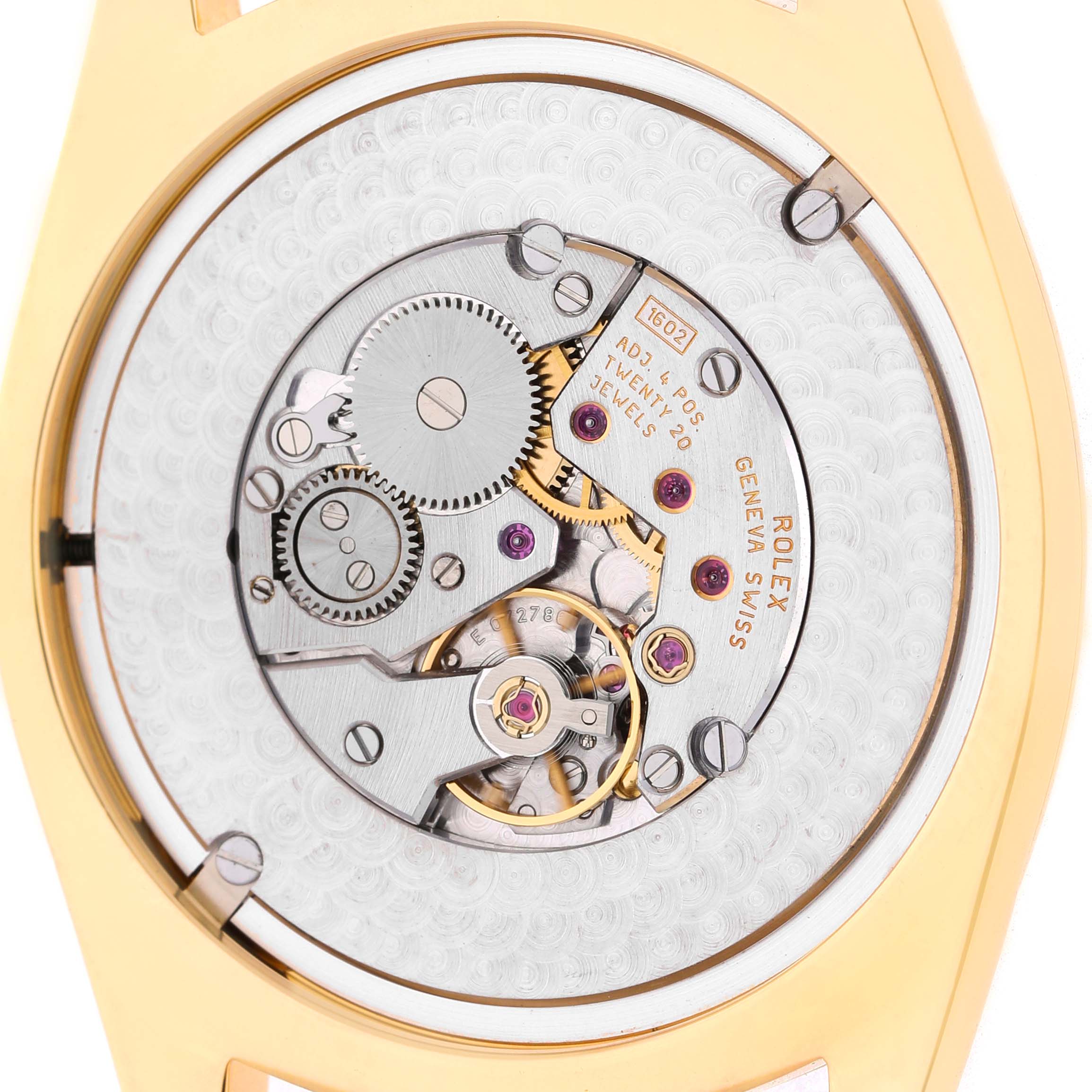 The image shows the movement of a Rolex Cellini 4243 Men's Yellow Gold Champagne Dial watch from the back, displaying gears and jewels.