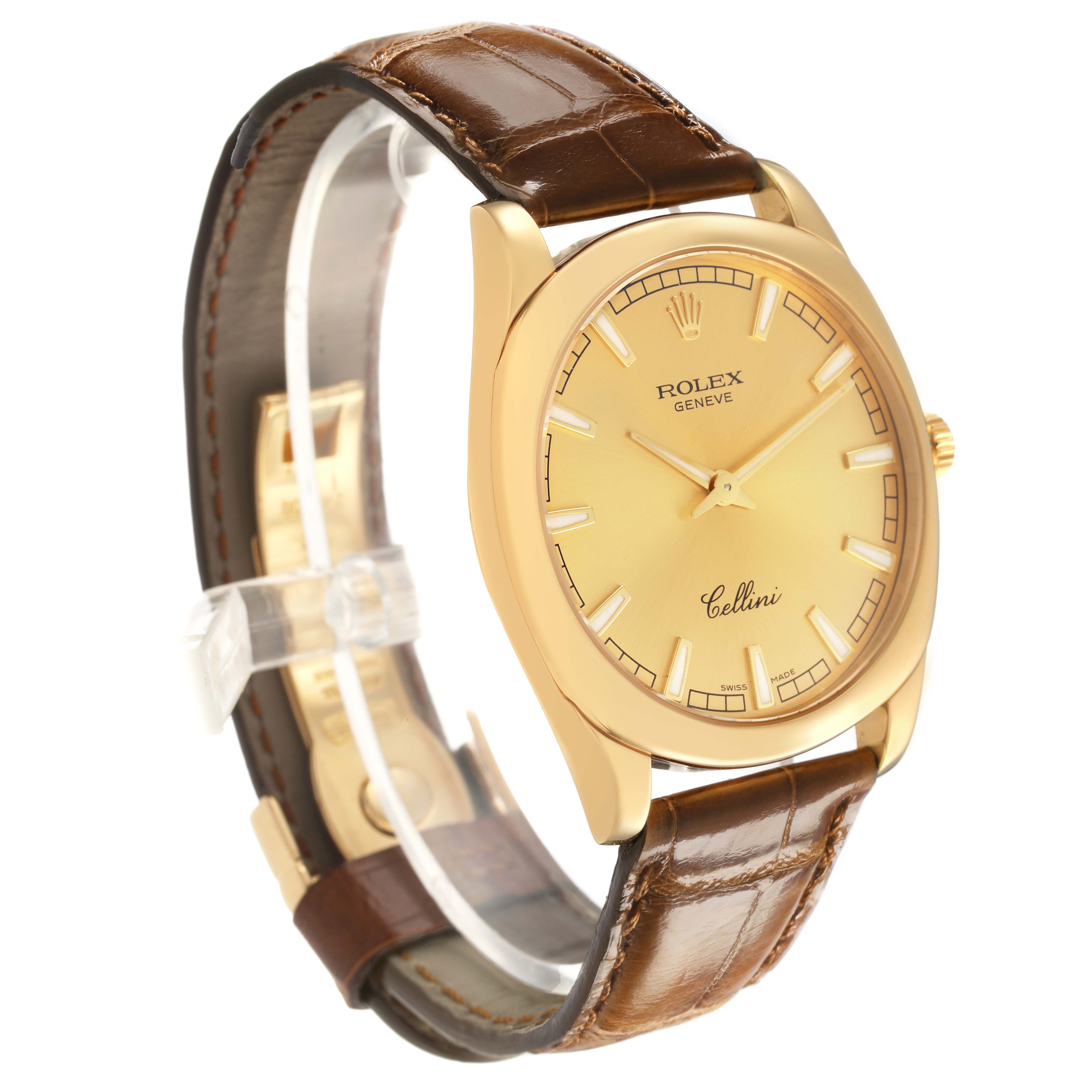 The Rolex Cellini 4243 Men's Yellow Gold Champagne Dial watch is shown at a three-quarter angle, highlighting the gold case, brown leather strap, and dial details.