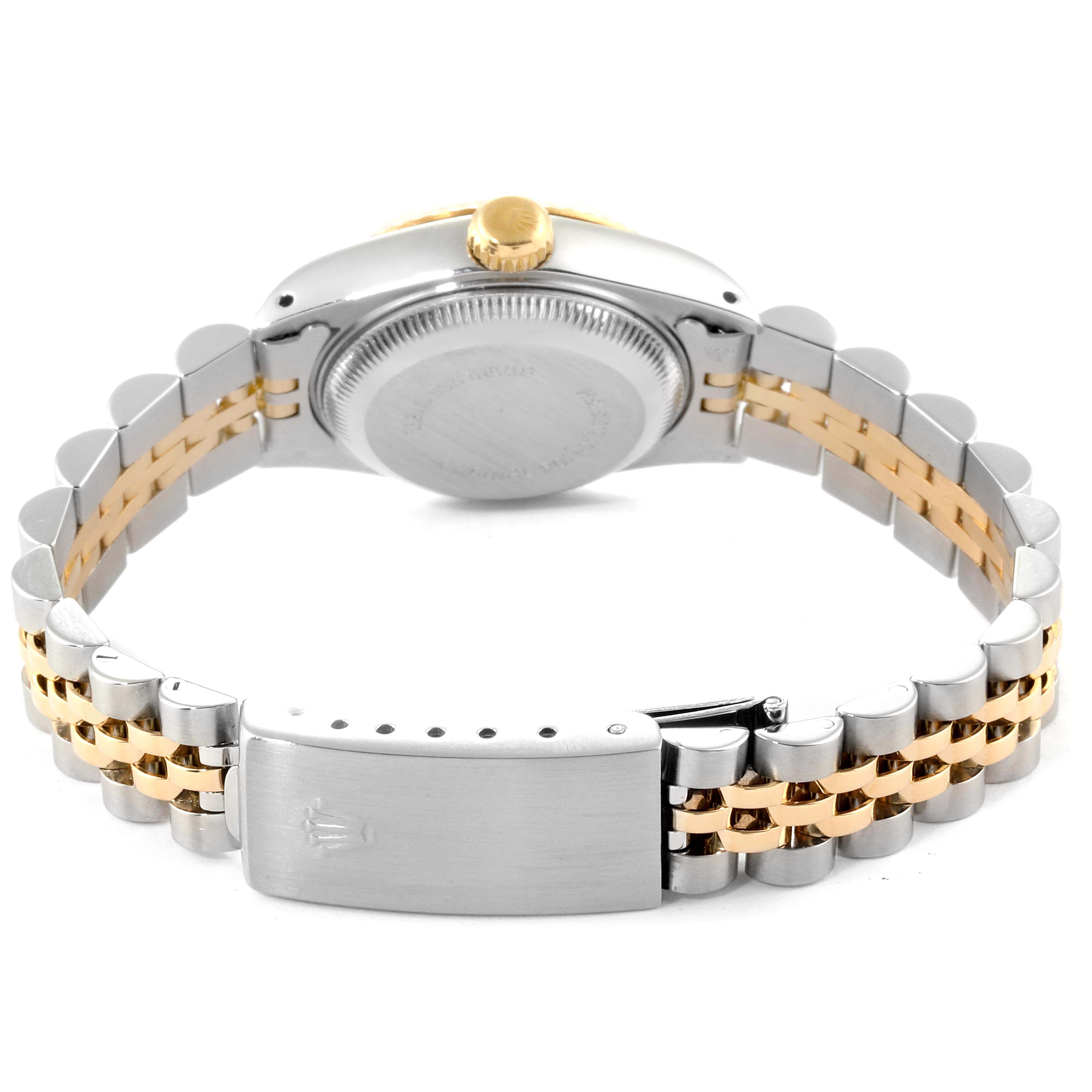 The image shows the back view of a Rolex Datejust 69173  Women's Stainless Steel Champagne Dial 69173  Women's Stainless Steel Champagne Dial watch, highlighting its case back, crown, and bracelet.