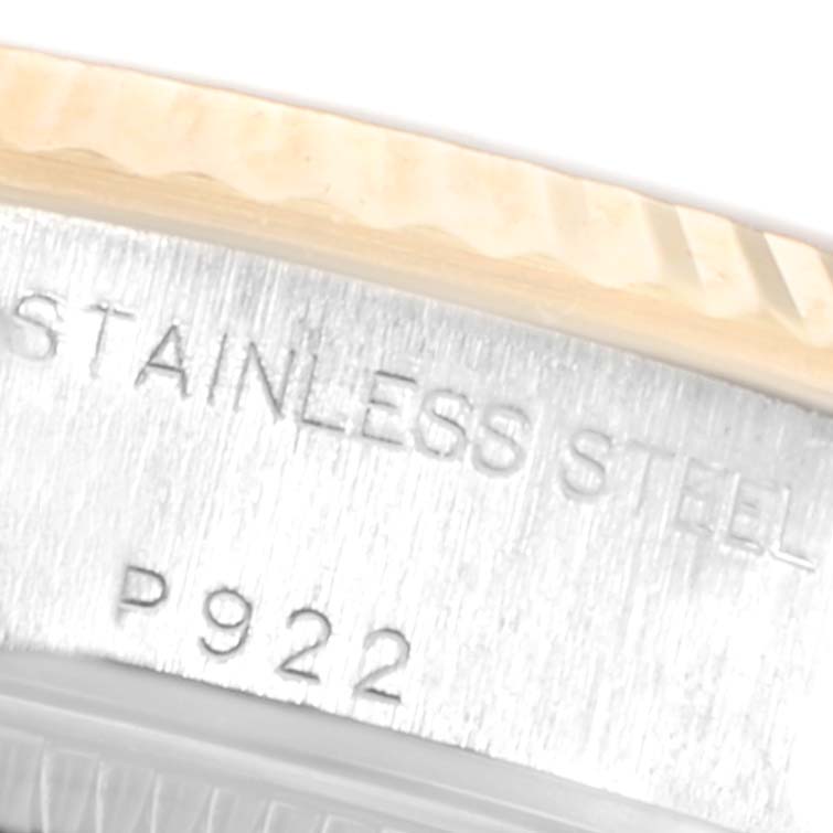 The image shows a close-up of the side of the case and bezel of a Rolex Datejust 79173 Women's Steel and Gold (two tone) White Dial 79173 Women's Steel and Gold (two tone) White Dial model, highlighting the "STAINLESS STEEL" engraving.