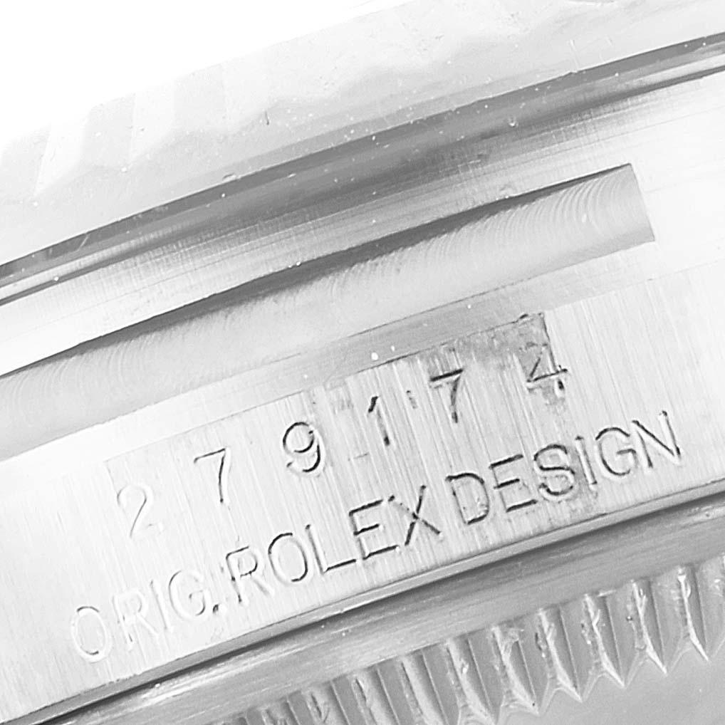 This image shows an extreme close-up of the serial number engraving on the side of a Rolex Datejust 279174 Women's Stainless Steel Grey Dial 279174 Women's Stainless Steel Grey Dial watch case.
