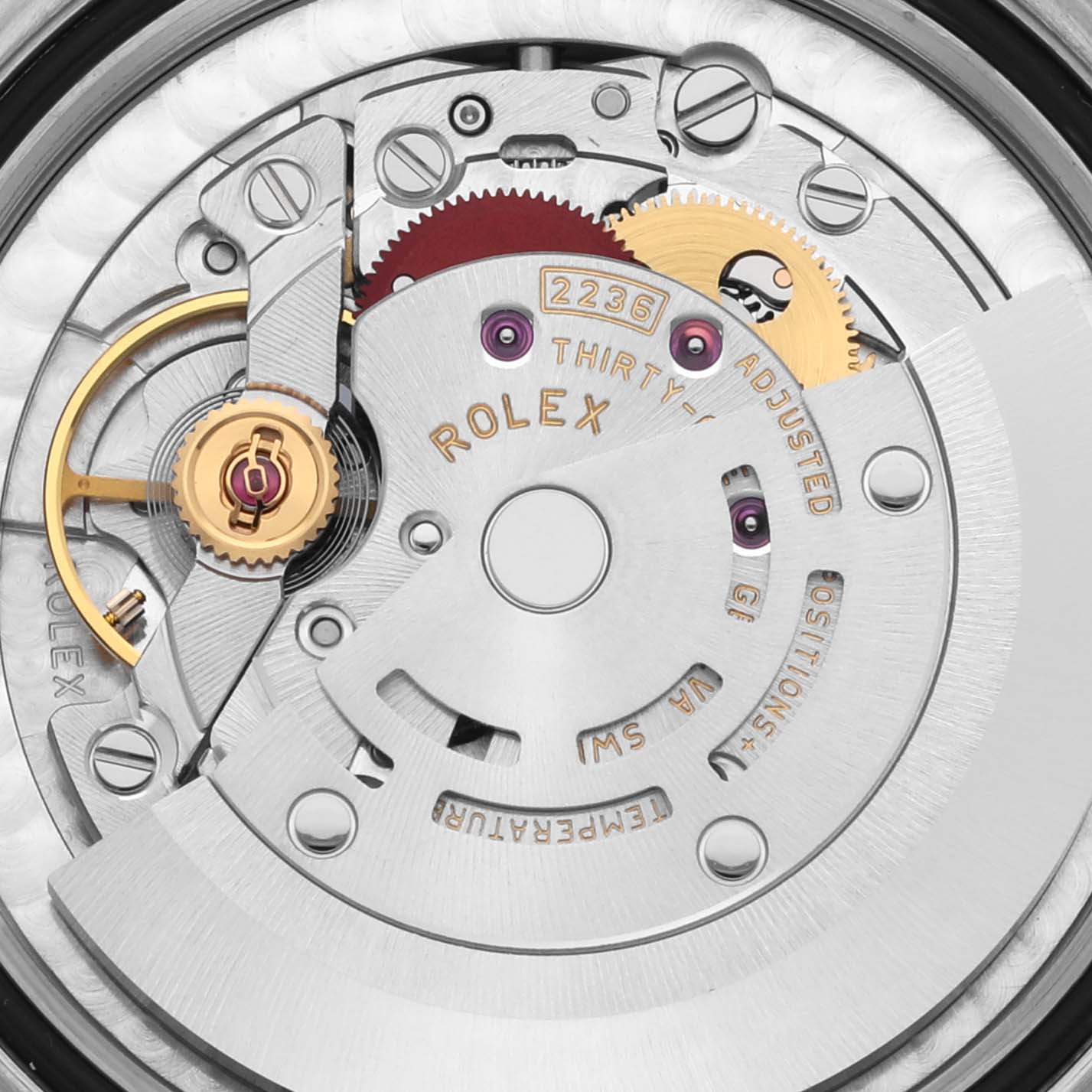 The image shows the internal movement of a Rolex Mid-Size 278241 Women's Steel and Gold (two tone) Pink Dial 278241 Women's Steel and Gold (two tone) Pink Dial model, highlighting gears and the rotor.