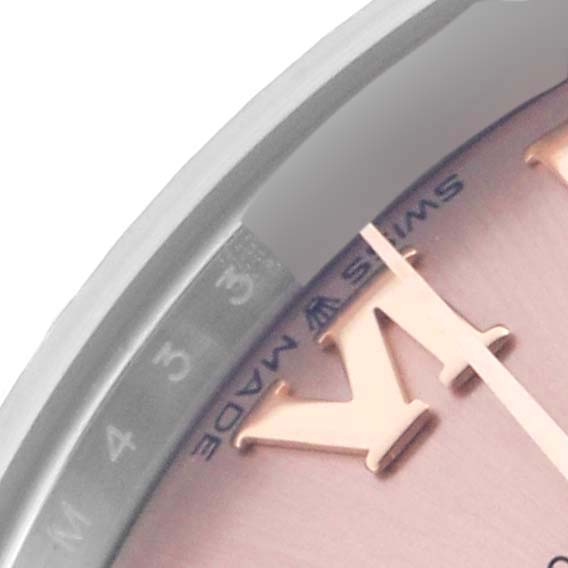 The image shows a close-up at an angle of the dial and bezel of a Rolex Mid-Size 278271 Women's Steel and Gold (two tone) Pink Dial 278271 Women's Steel and Gold (two tone) Pink Dial watch, highlighting the numeral and text details.