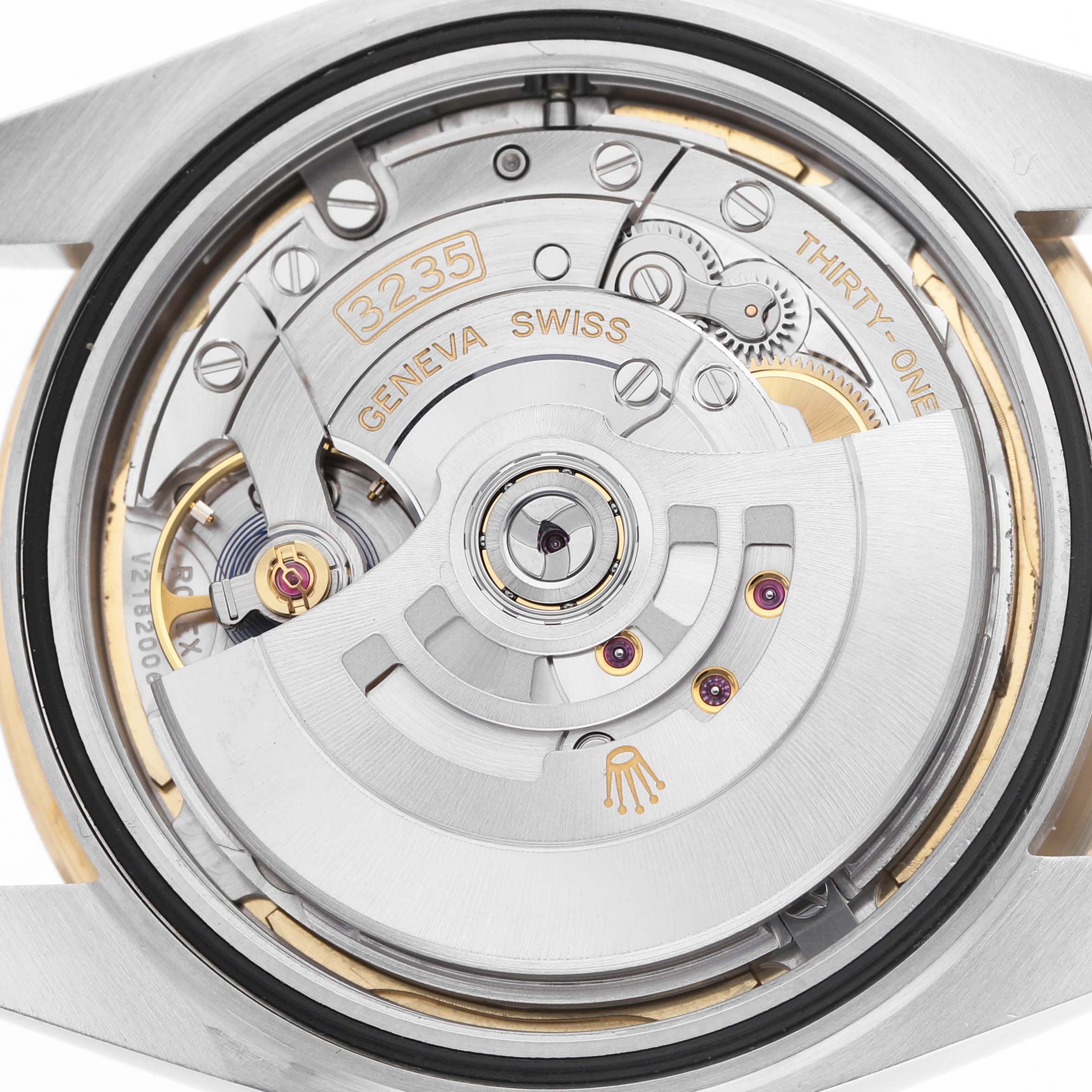 The image shows the movement of a Rolex Datejust 41 M126333-0011 Men's Steel and Gold (two tone) Champagne Dial, focusing on the oscillating weight and internal gears from the back angle.