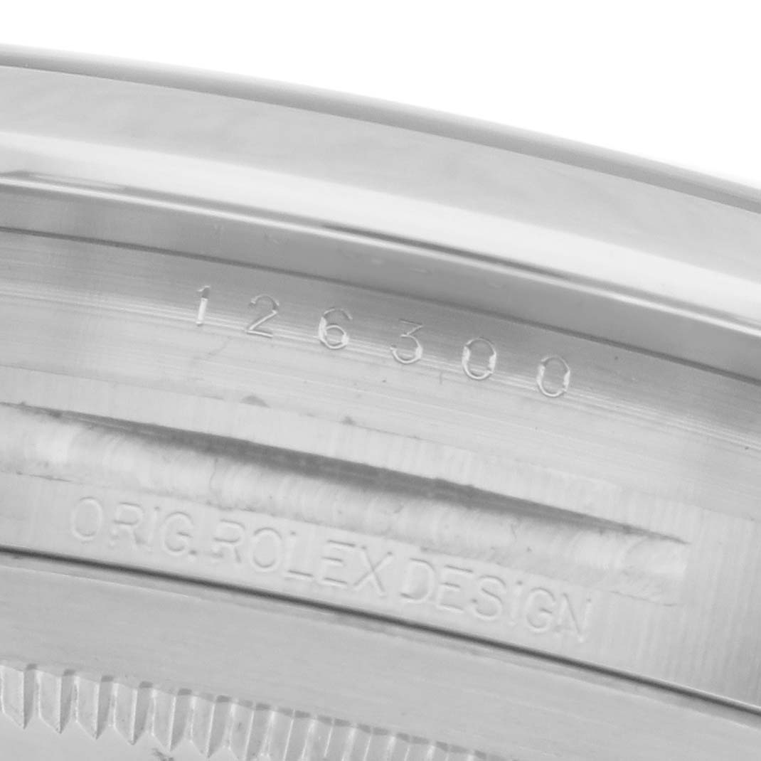 The image shows a close-up of the engraving on the caseback rim of a Rolex Datejust 41 126300 Men's Stainless Steel Silver Dial 126300 Men's Stainless Steel Silver Dial.