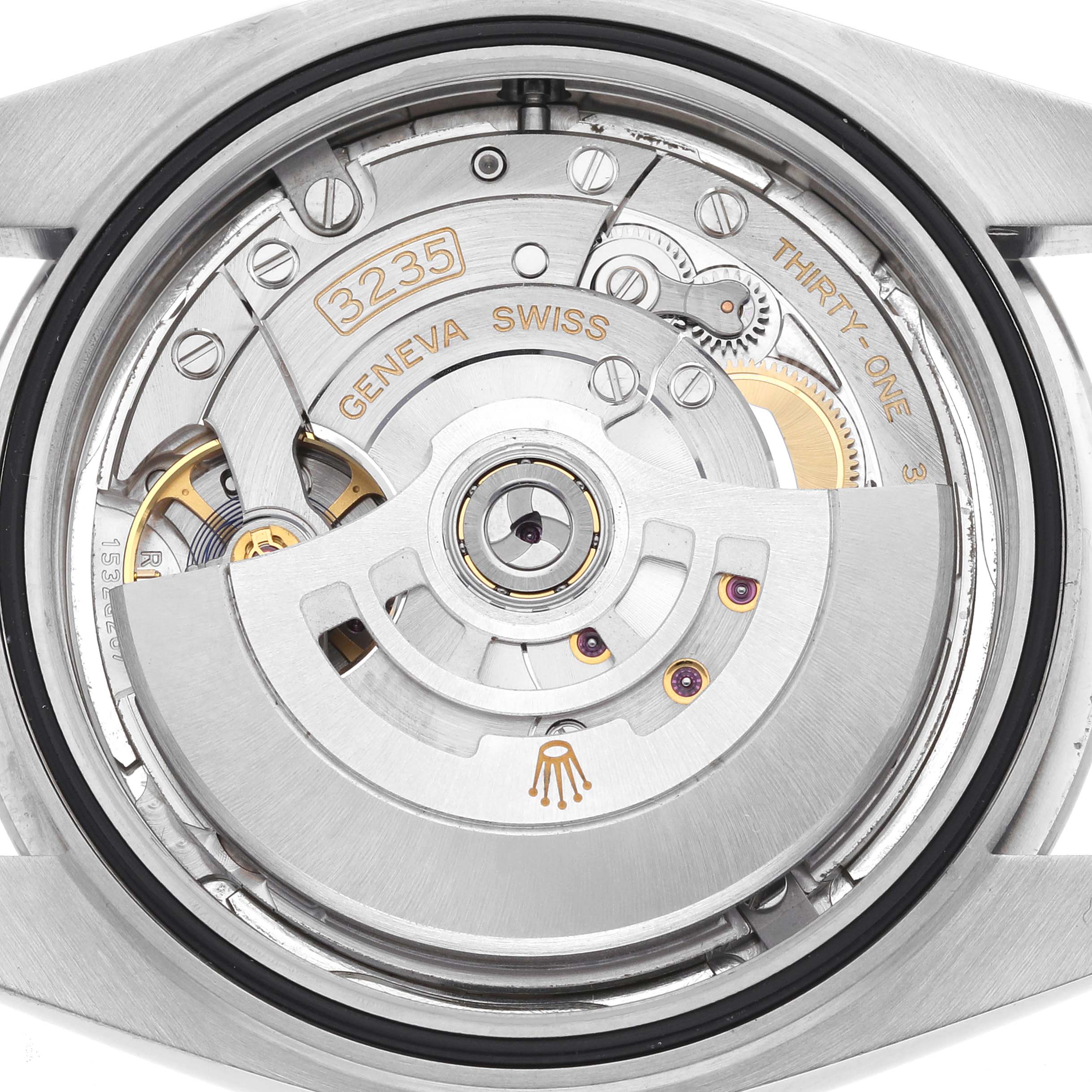 The image shows the movement of a Rolex Datejust 41 126300 Men's Stainless Steel Silver Dial 126300 Men's Stainless Steel Silver Dial watch from the back, highlighting the rotor and internal components.