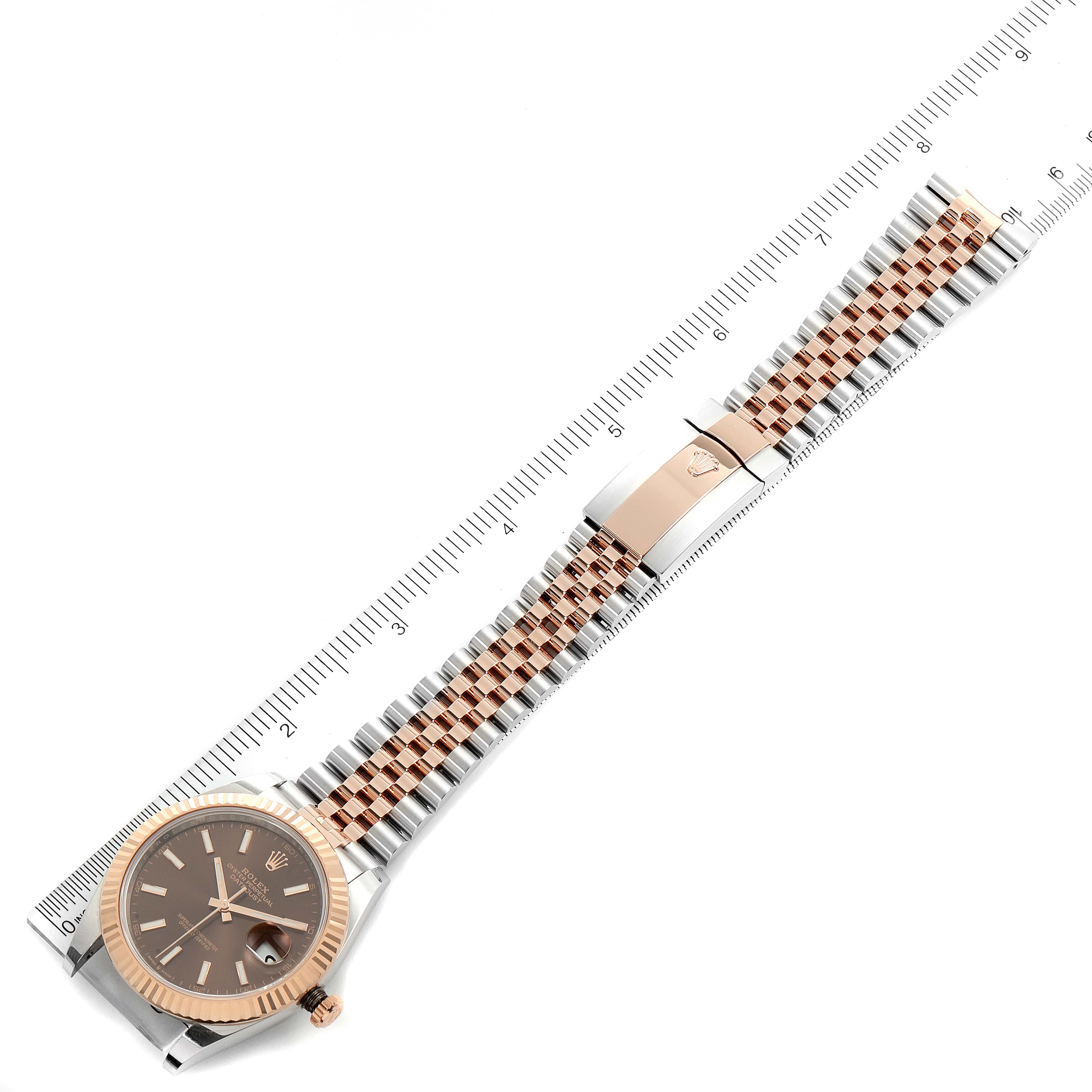 This image shows a Rolex Datejust 41 126331 Men's Steel and Gold (two tone) Brown Dial 126331 Men's Steel and Gold (two tone) Brown Dial watch laid flat with its full dial, bracelet, and deployment clasp visible against a ruler for measurement.