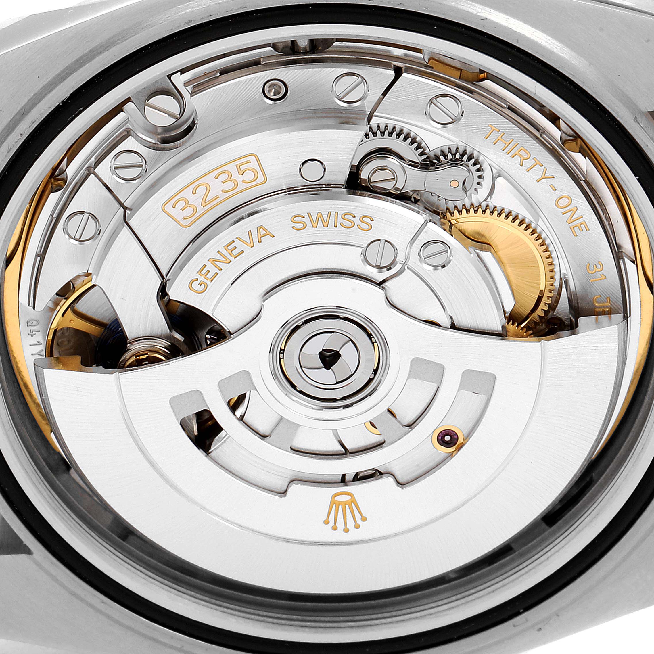 This image shows the movement mechanism of the Rolex Datejust 41 126331 Men's Steel and Gold (two tone) Brown Dial 126331 Men's Steel and Gold (two tone) Brown Dial model from the back angle, highlighting the intricate parts and engravings.
