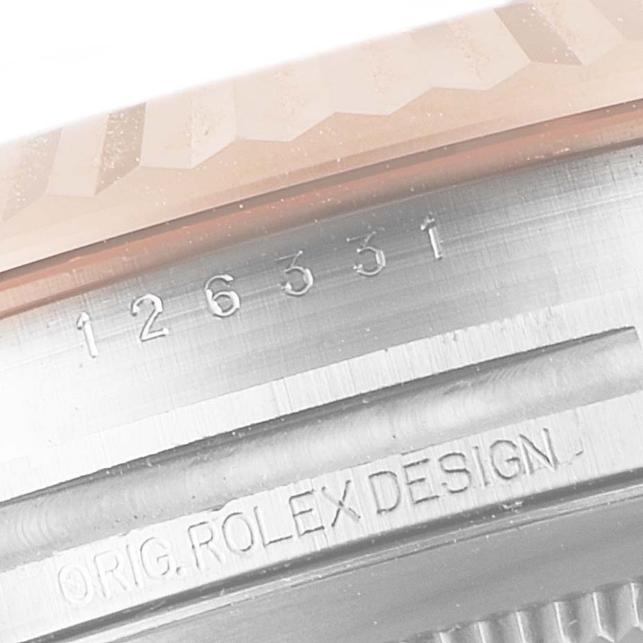 This image shows a close-up of the case side of a Rolex Datejust 41 126331 Men's Steel and Gold (two tone) Brown Dial 126331 Men's Steel and Gold (two tone) Brown Dial, featuring the model number and "Orig. Rolex Design" engraving.