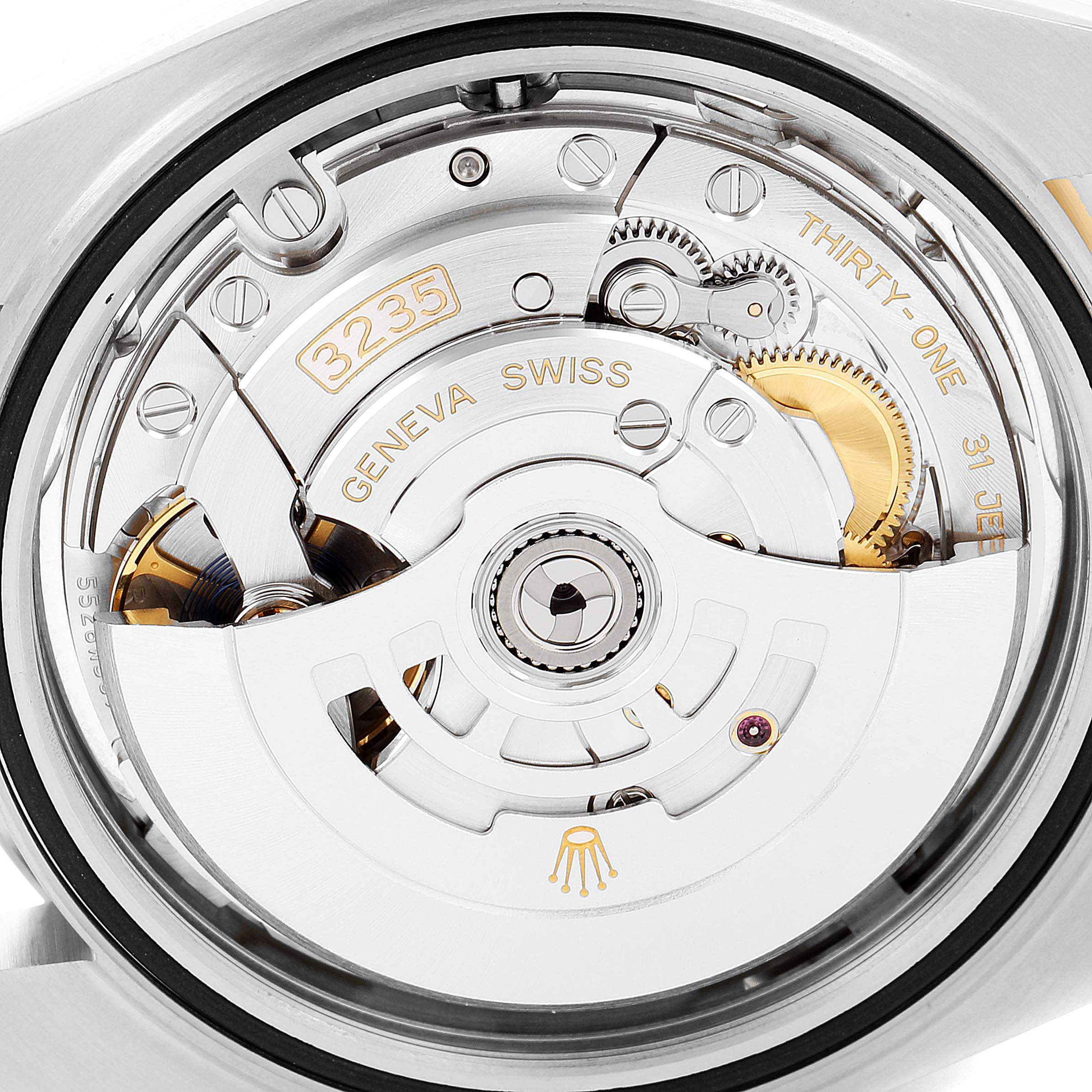 Close-up of the Rolex Datejust 41 126333 Men's Steel and Gold (two tone) Silver Dial 126333 Men's Steel and Gold (two tone) Silver Dial model's automatic movement, showcasing the intricate internal mechanism and branding details.