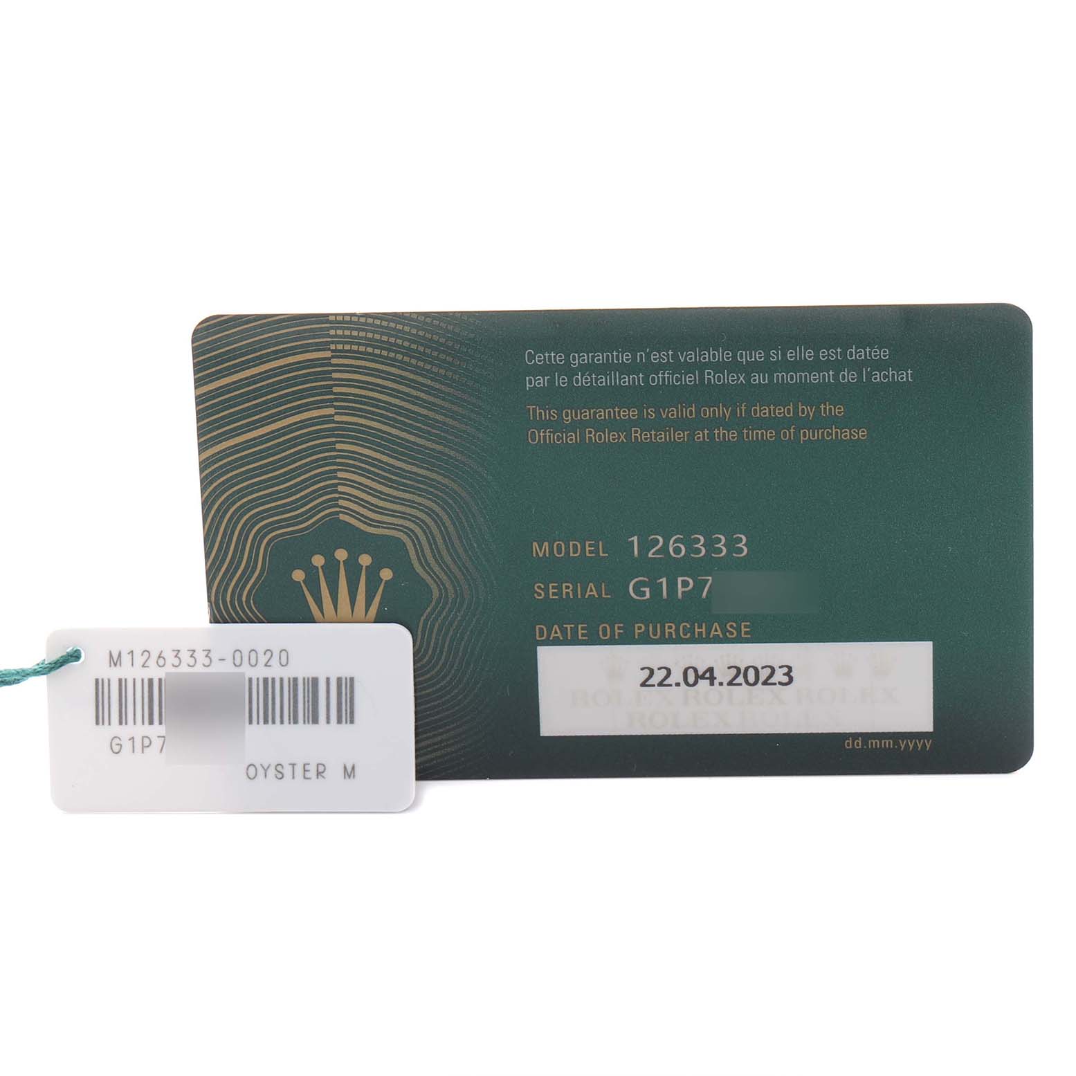 The image shows a Rolex Datejust 41 126333 Men's Steel and Gold (two tone) Grey Dial 126333 Men's Steel and Gold (two tone) Grey Dial warranty card and a tag, displaying the model and serial information.