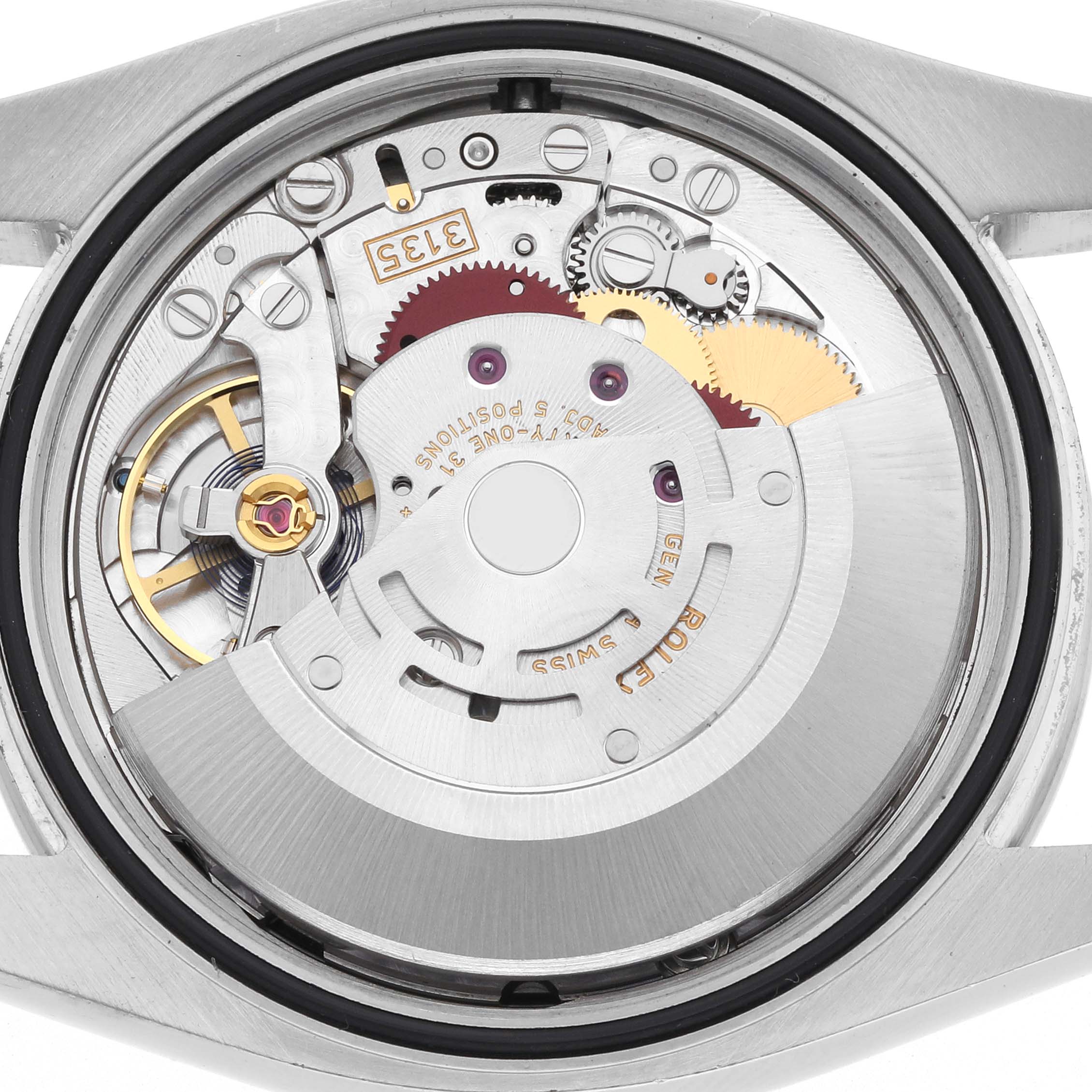 The image shows the movement mechanism of the Rolex Datejust 116244 Men
s Stainless Steel Black Dial 116244 Men
s Stainless Steel Black Dial, viewed from the back, highlighting gears and the rotor.
