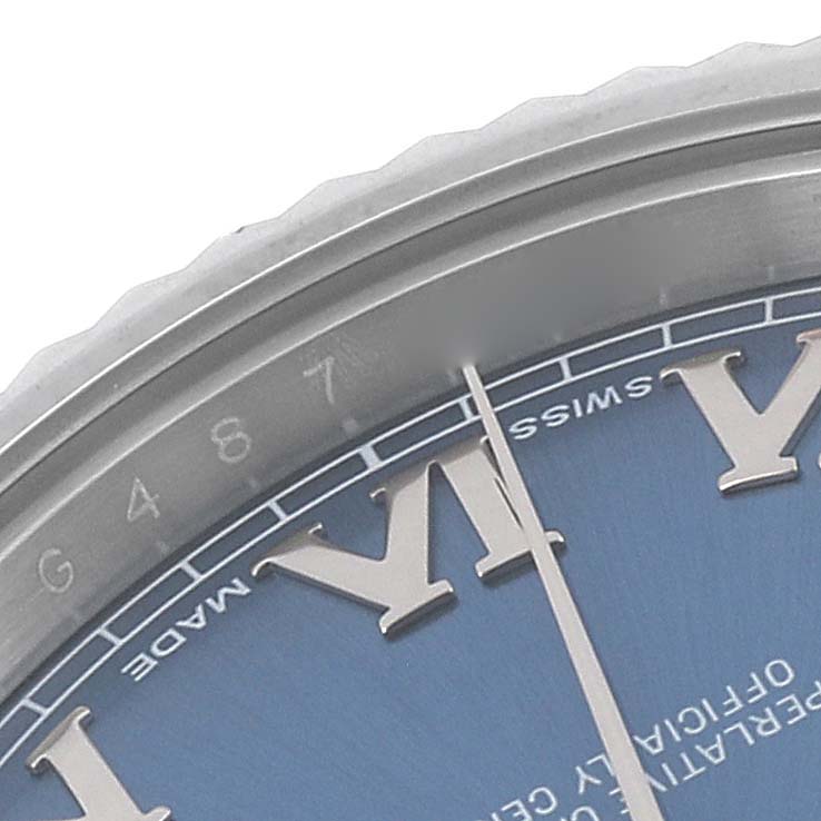The image shows a close-up of the edge of the dial and bezel of a Rolex Datejust 41 116334 Men's Stainless Steel Blue Dial 116334 Men's Stainless Steel Blue Dial watch.