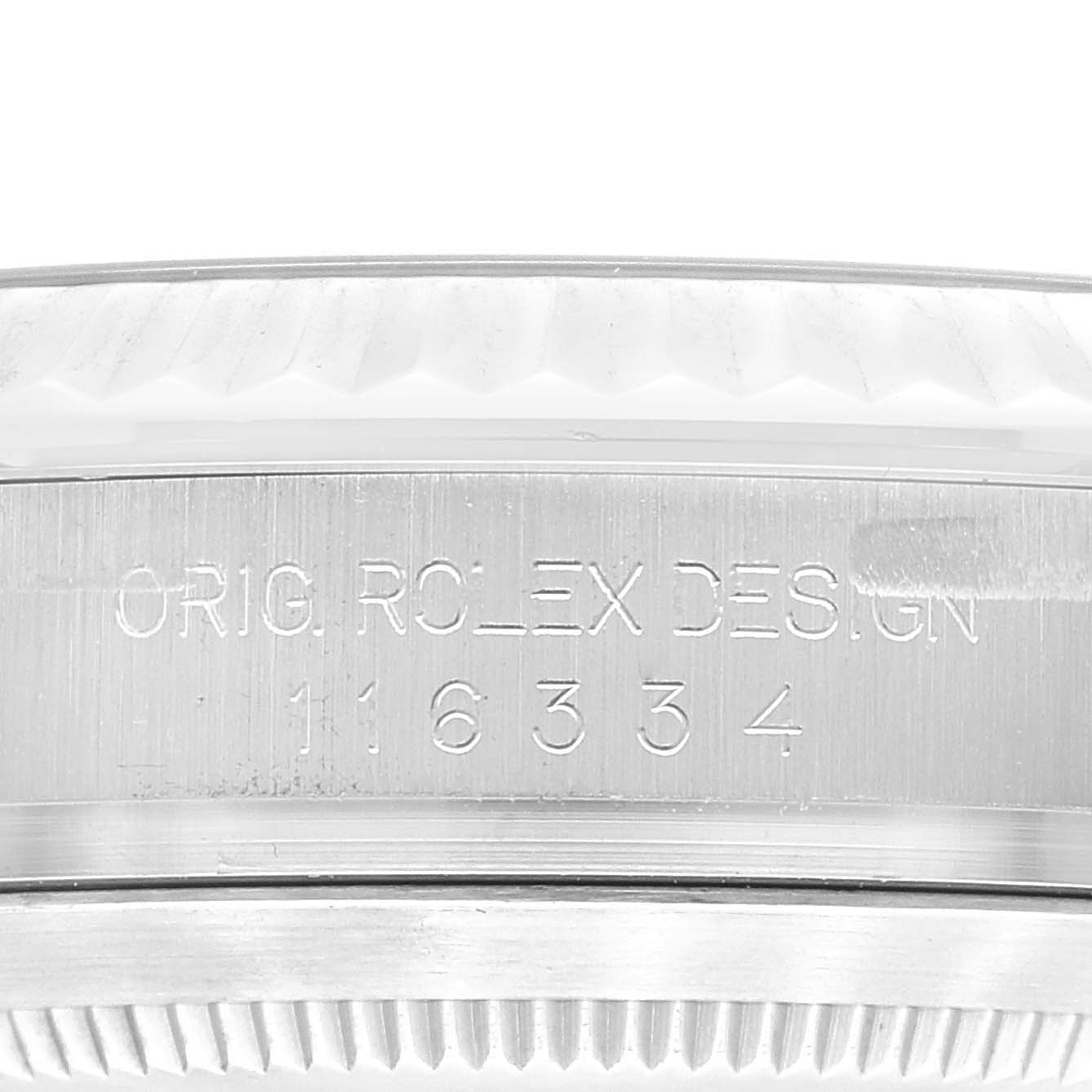 This image shows a close-up of the serial engraving and bezel of a Rolex Datejust 41 116334 Men's Stainless Steel Blue Dial 116334 Men's Stainless Steel Blue Dial model.