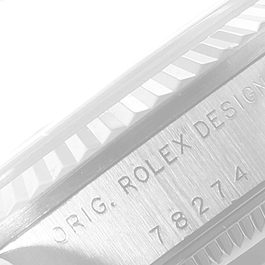 This image shows a close-up view of the side casing and serial engraving on a Rolex Mid-Size 78274 Women's Stainless Steel Beige Dial 78274 Women's Stainless Steel Beige Dial watch.