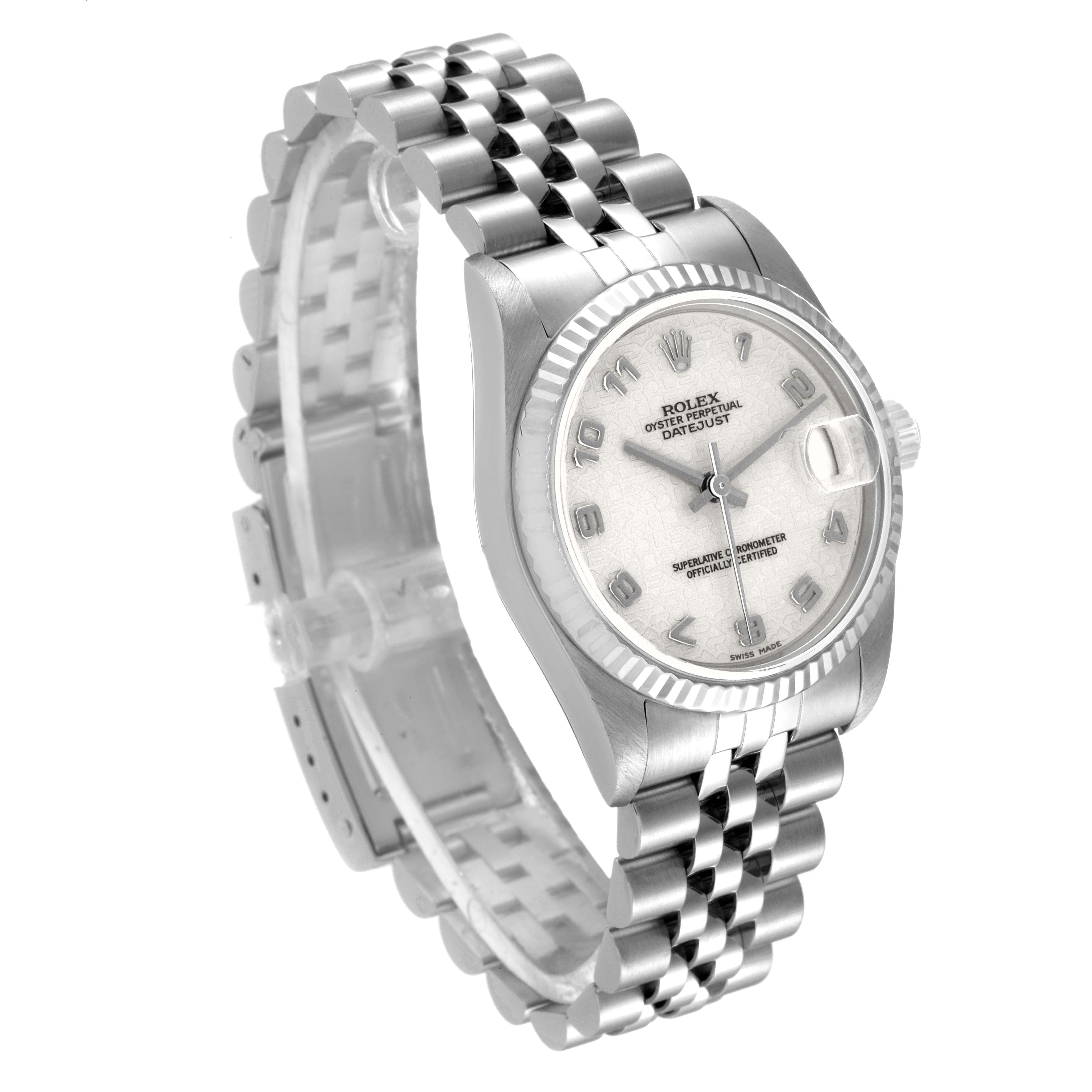 The image shows a mid-size Rolex watch at an oblique angle, featuring the face, bezel, and bracelet.