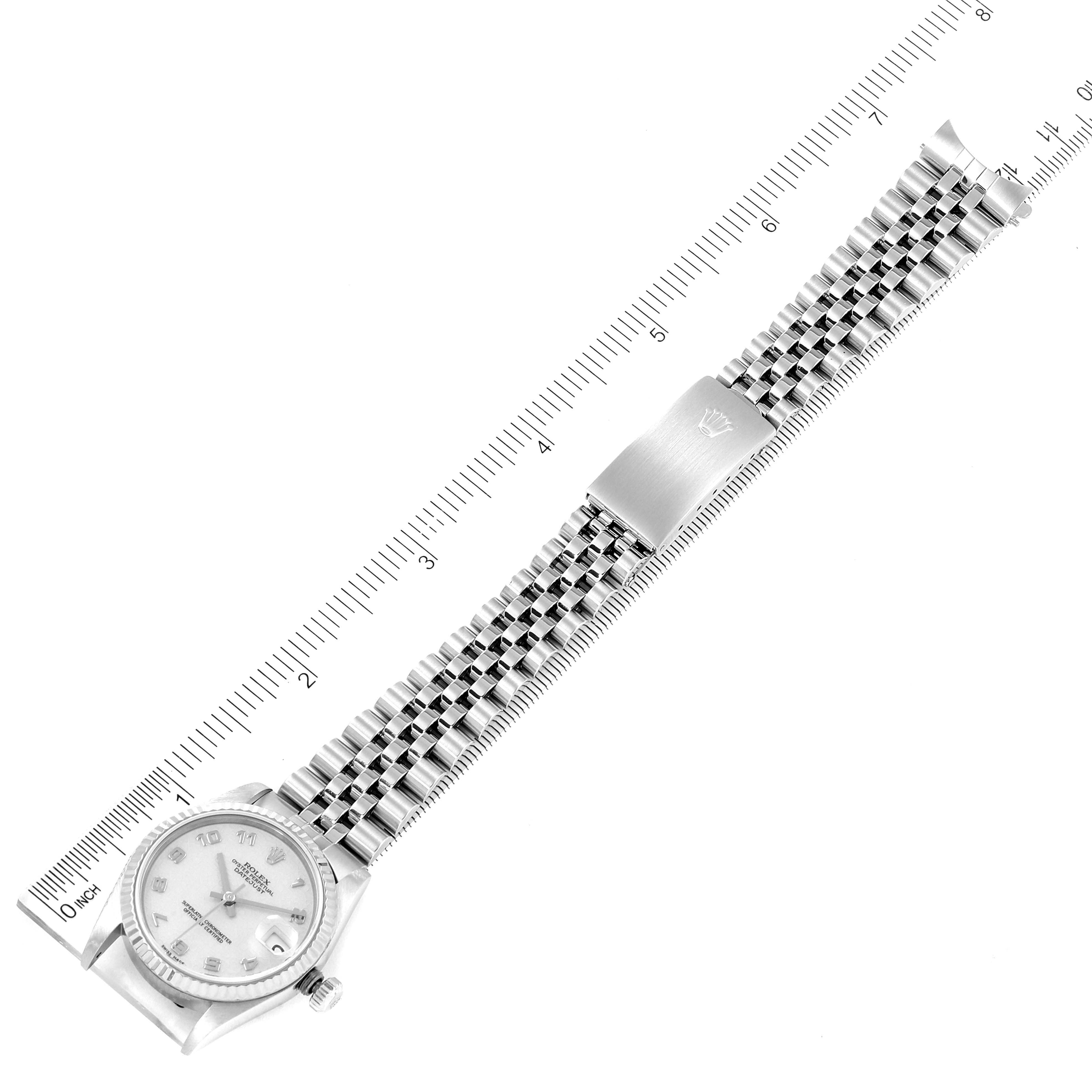 The image shows a Rolex Mid-Size 78274 Women's Stainless Steel Beige Dial 78274 Women's Stainless Steel Beige Dial watch at an overhead angle, displaying the face, bracelet, and clasp with a ruler for scale.